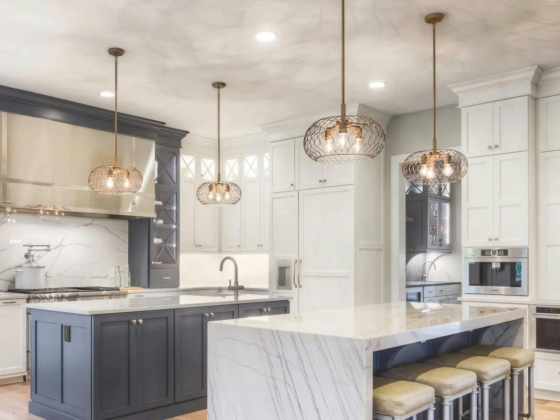 Modern farmhouse kitchen with brass Devin pendant lights hanging throughout