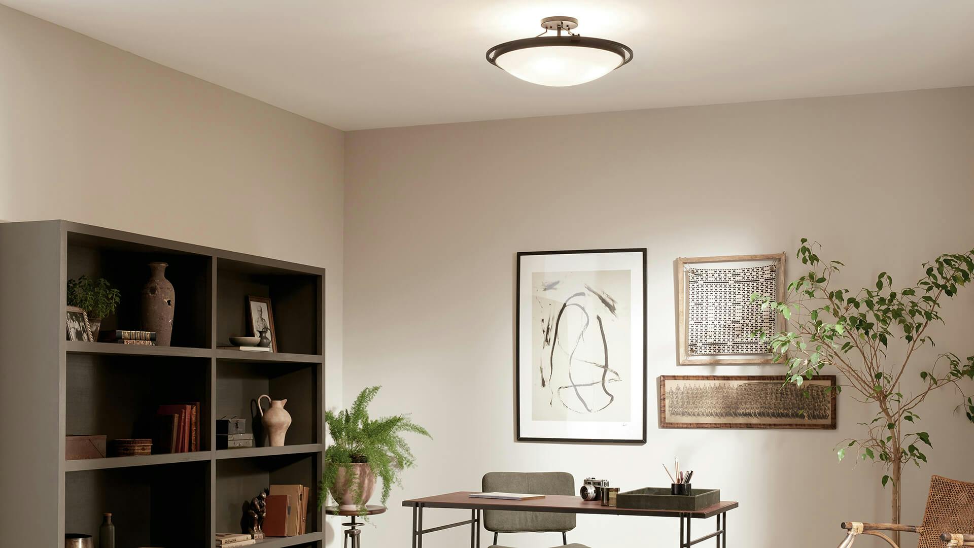 Office scene with a semi-flush ceiling light glowing above the room