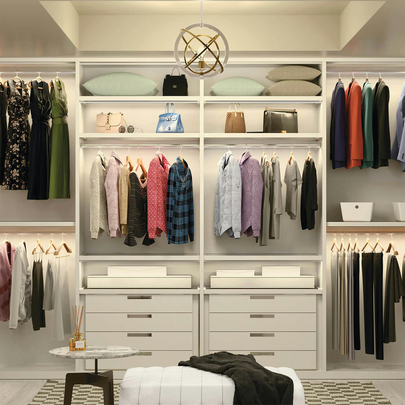 Closet featuring both a mini chandelier and downlights that are lit