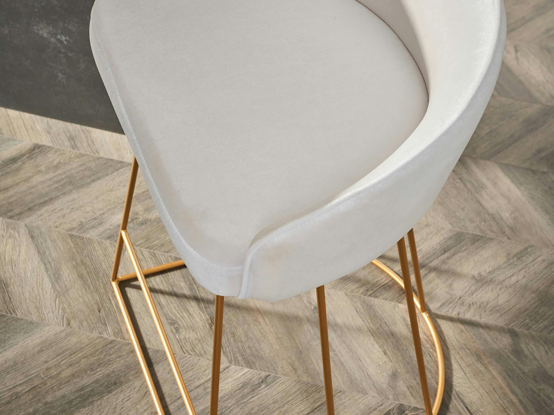 Close up of a white bar stool from above