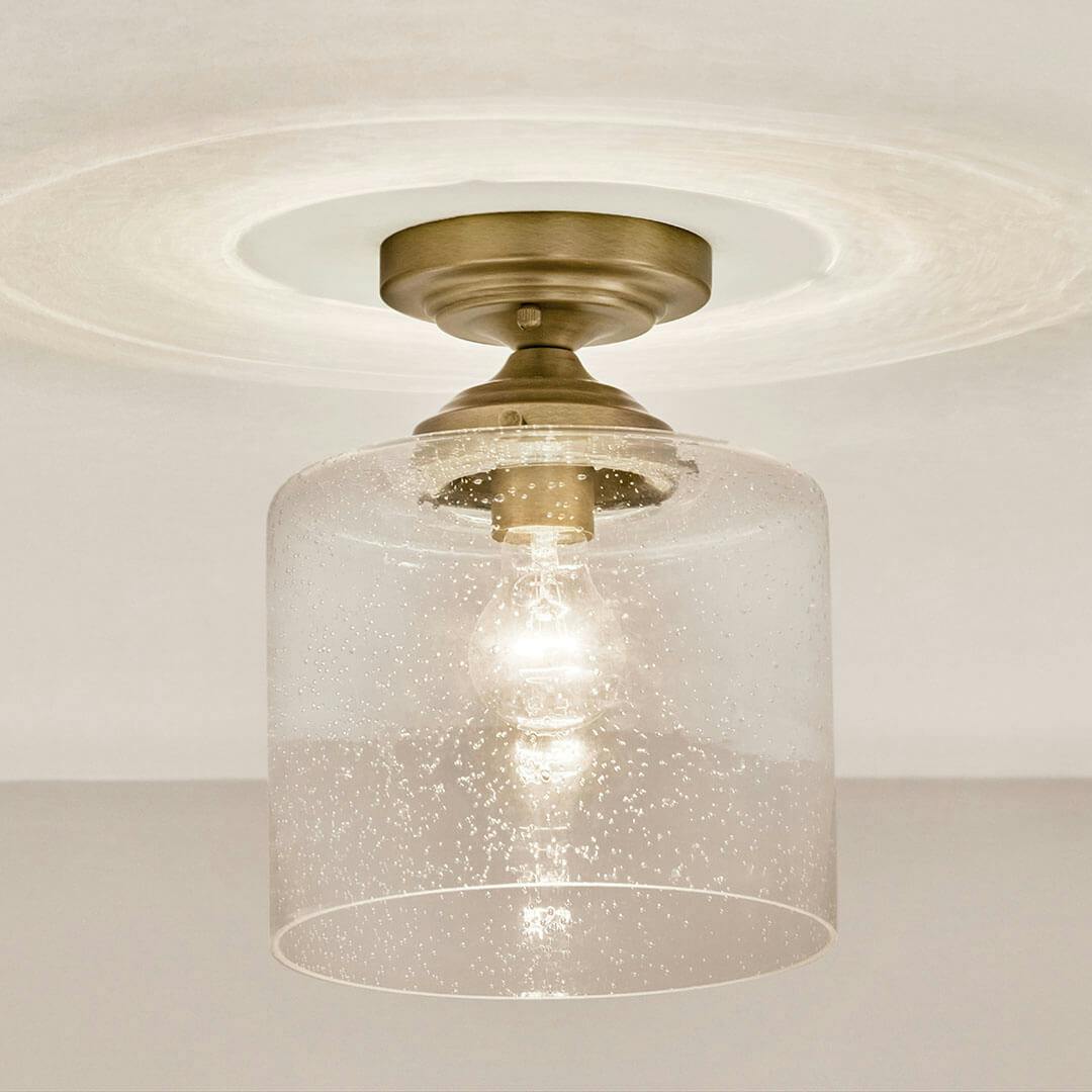 Bathroom in day light with the Winslow 10.75" 1-Light Semi Flush in Natural Brass