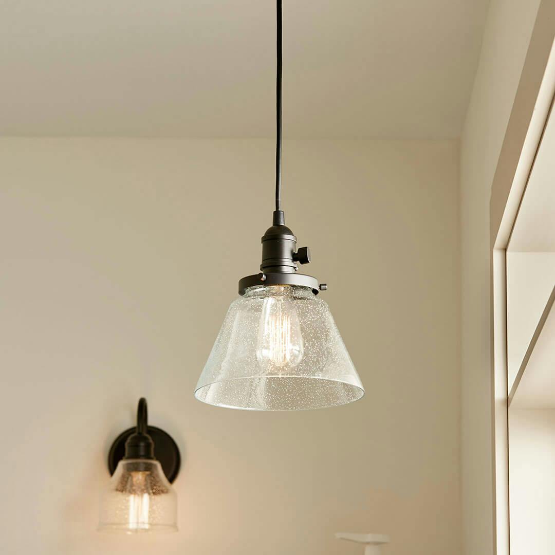 Laundry room in day light with the Avery 9 Inch 1 Light Cone Mini Pendant with Clear Seeded Glass in Black