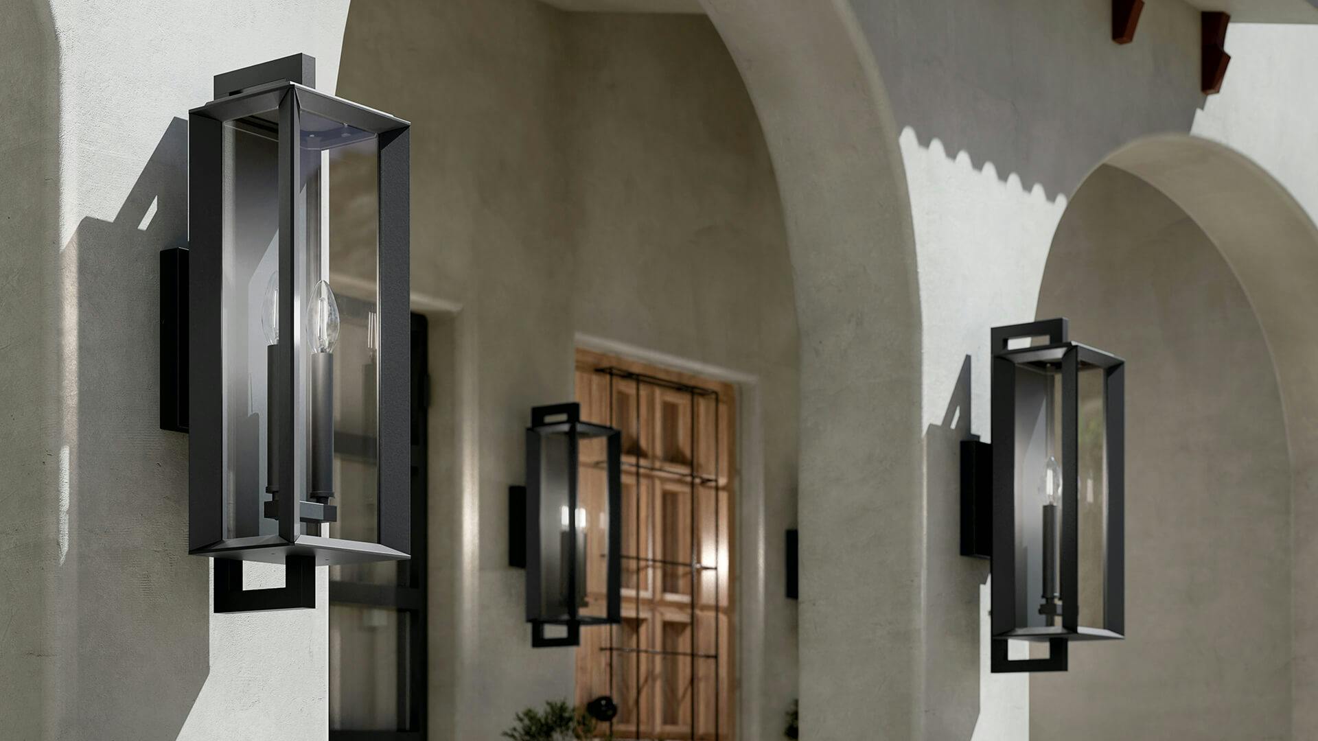 Exterior during the day with three kroft wall sconces in black finish