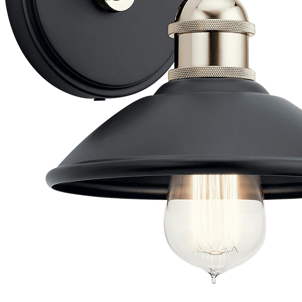 Close up view of the Clyde 1 Light Wall Sconce Black on a white background