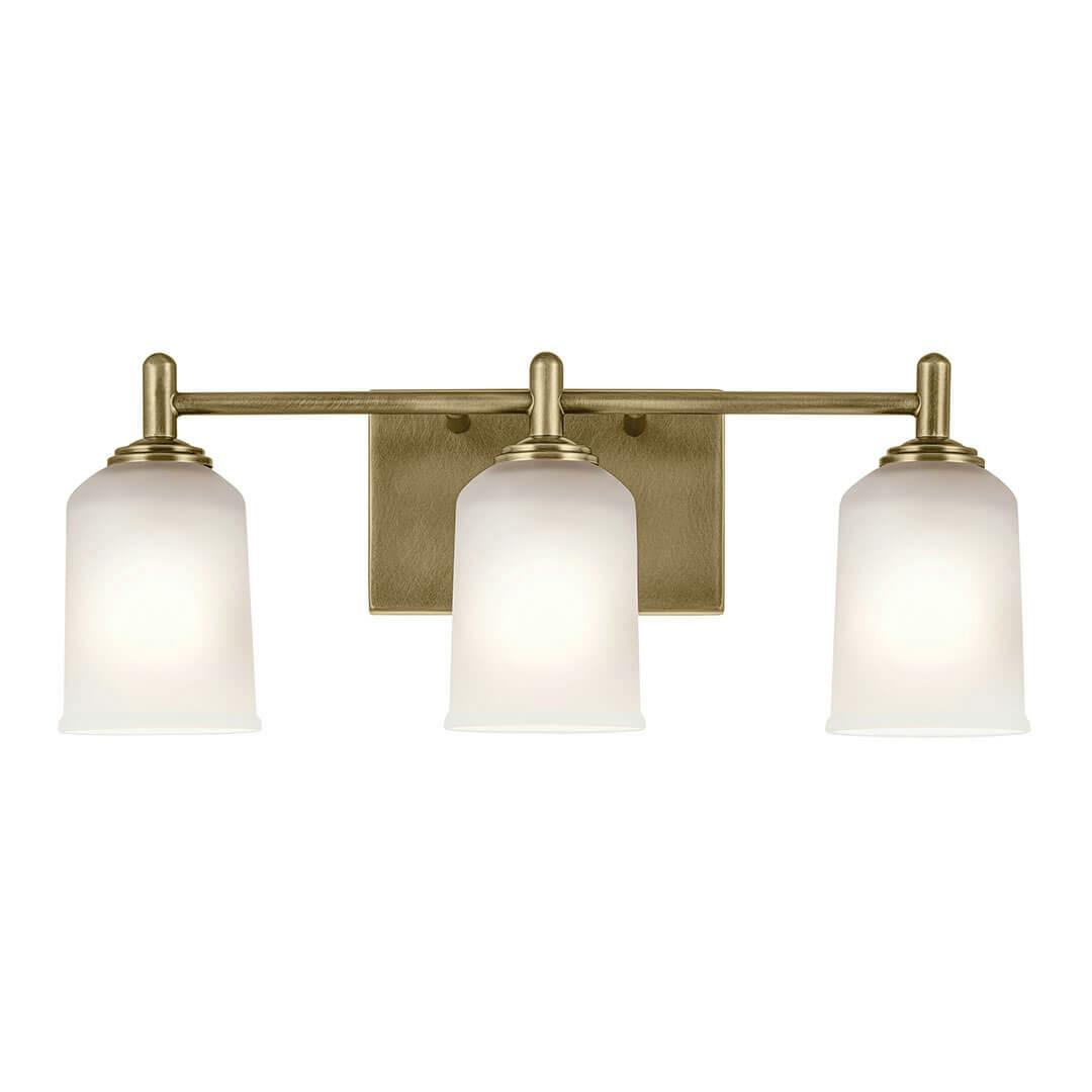 The Shailene 21" 3-Light Vanity Light in Natural Brass mounted down on a white background