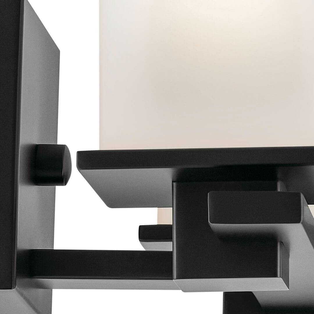Close up view of the Tully 15" 2-Light Vanity Light in Black on a white background