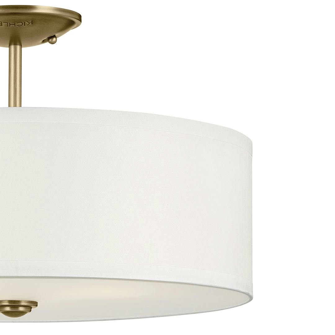 Close up view of the Shailene 11.5" 3-Light Small Round Semi Flush in Natural Brass on a white background