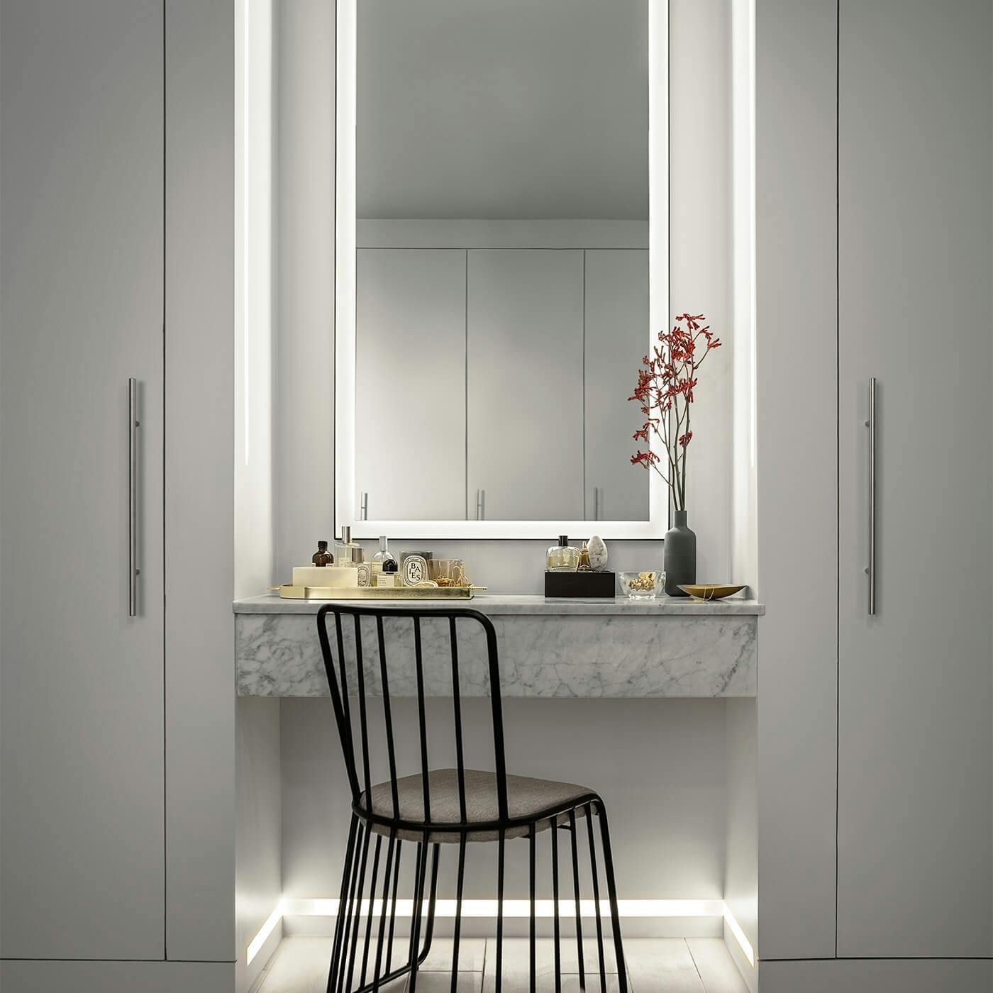 Vanity with Ryame lights around a mirror and at the end of the floor