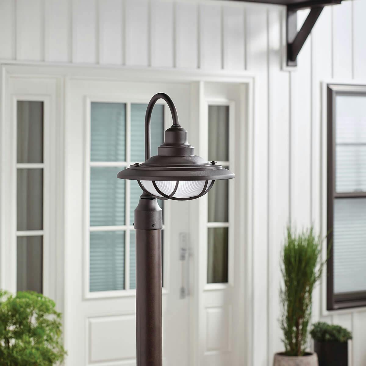 Day time outdoor entryway image featuring Harvest Ridge outdoor post light 49694BKT