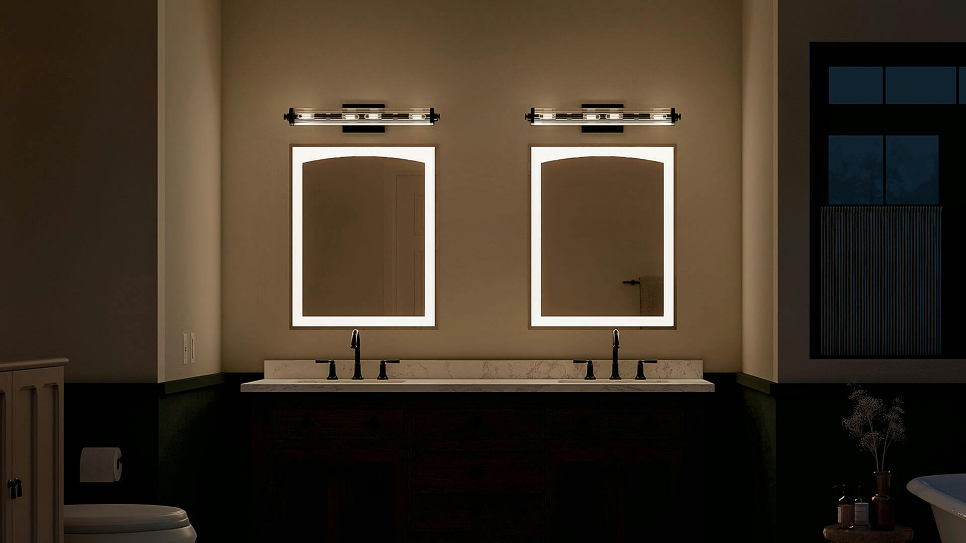 Dual mirrors and sink bathroom at night with Azores sconces above the mirrors