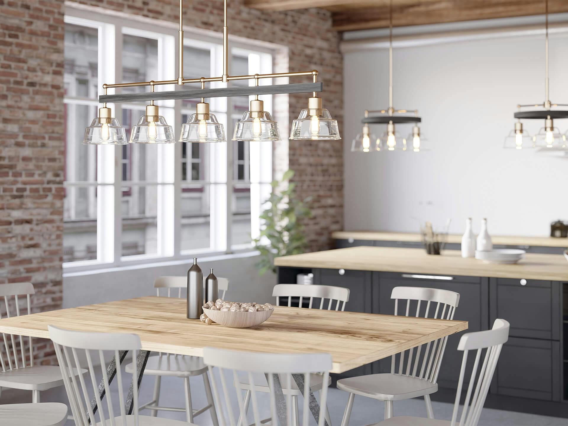 Kitchen setting with several Eastmont chandeliers across the dining room and island