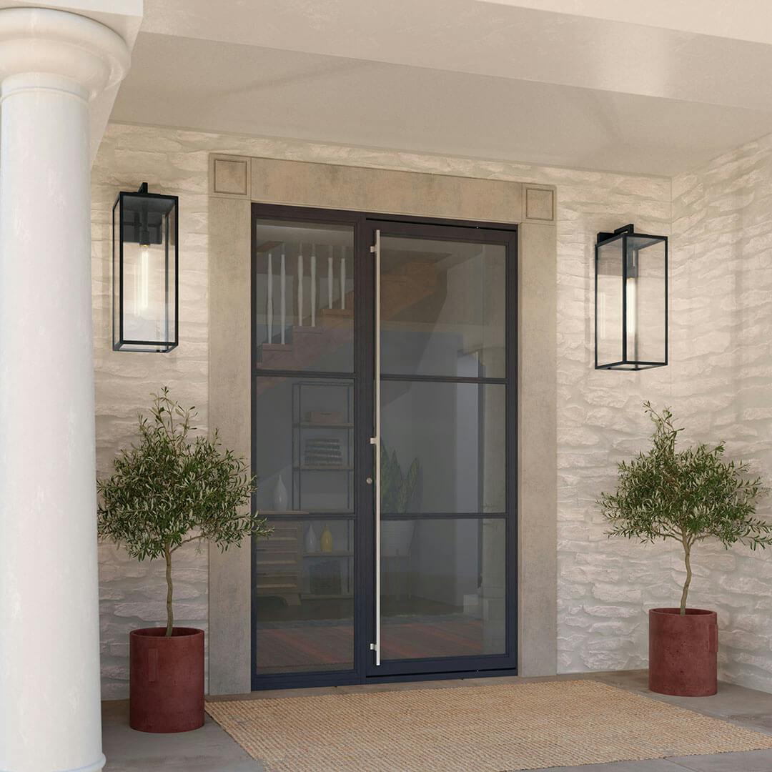 Home exterior with the Branner 24" 1 Light Outdoor Wall Light with Clear Glass in Textured Black