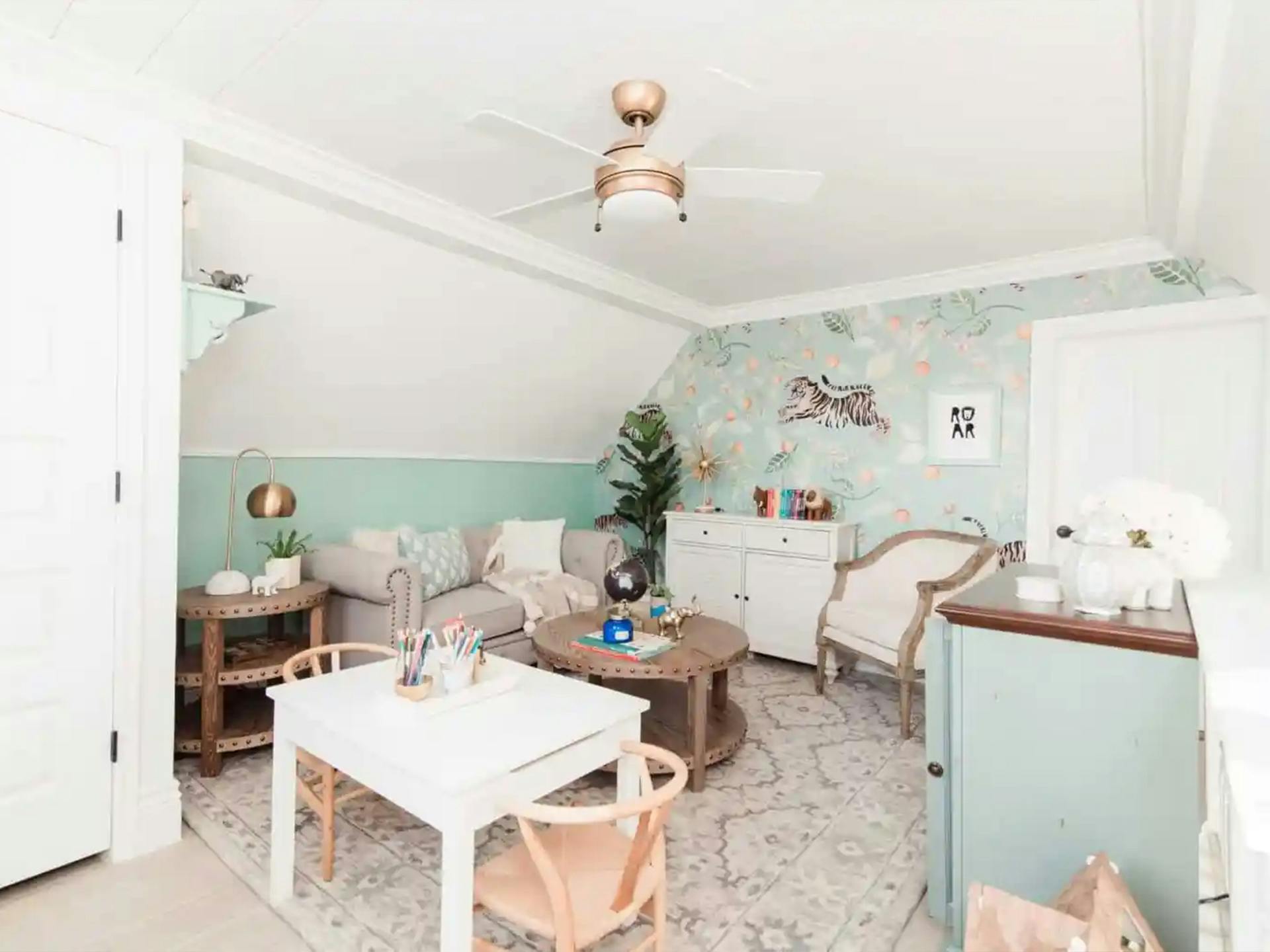 Ashley Wilson's Minty green den featuring a Kichler ceiling fan