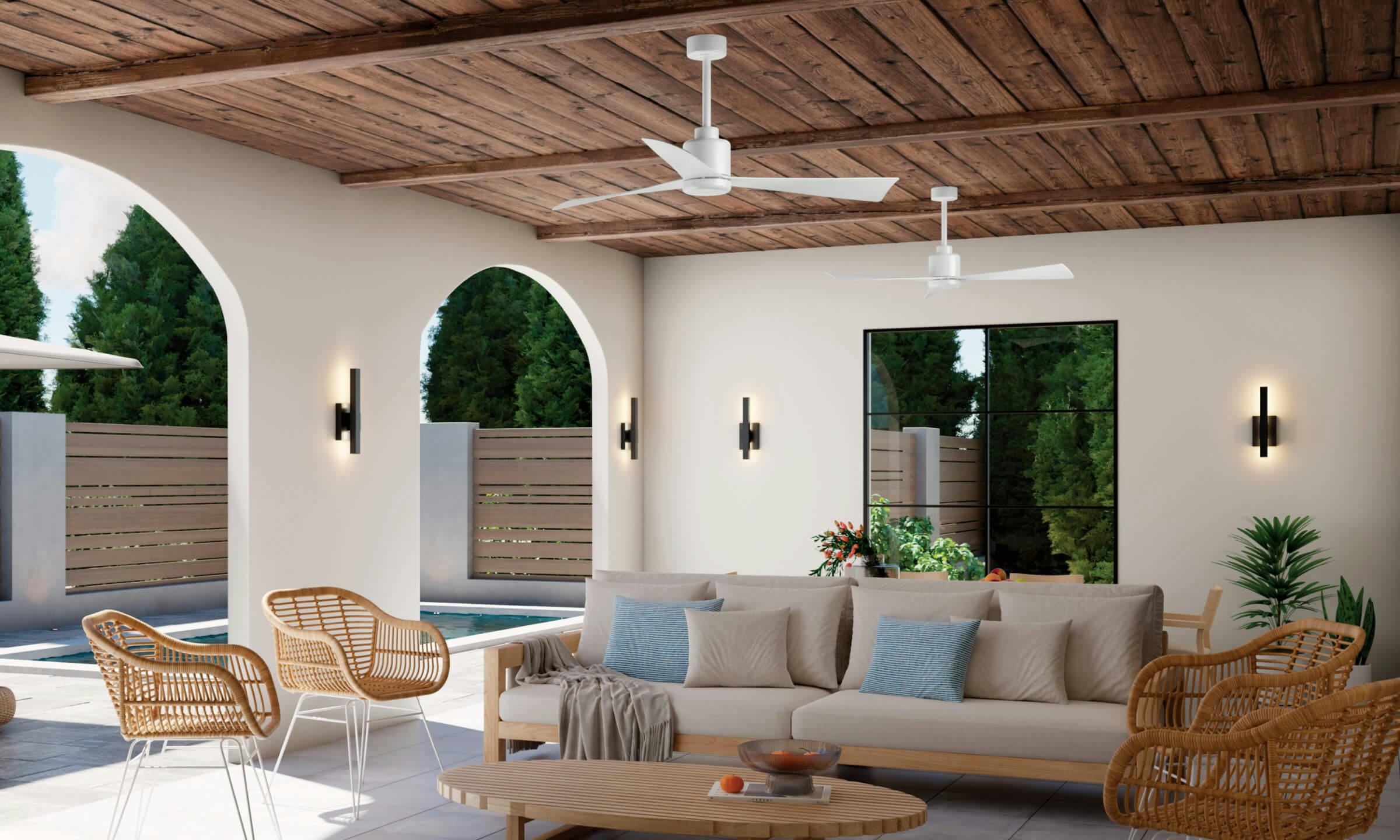 Day lit porch with two True ceiling fans and four illuminated sconces wrapped around the walls