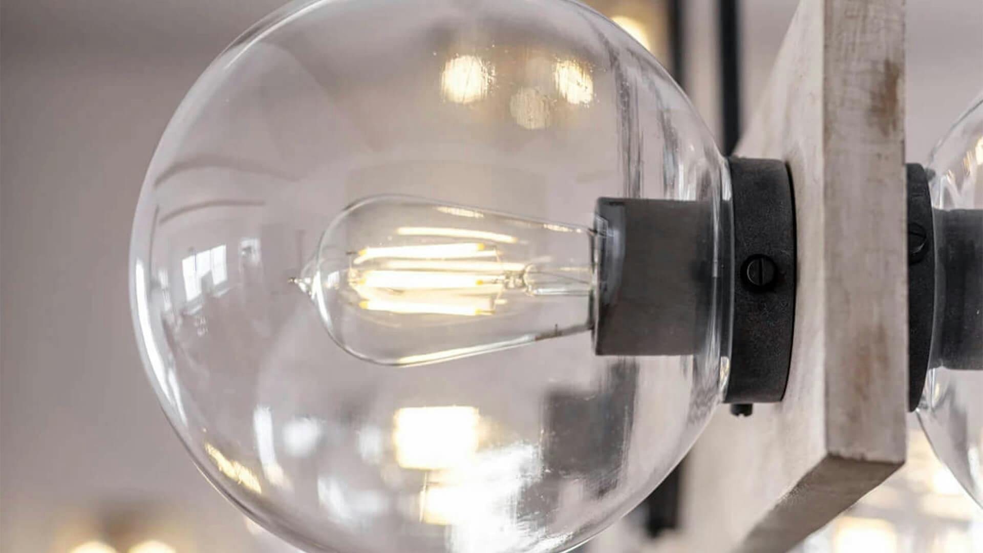 Detailed image of a vintage style light bulb turned on 