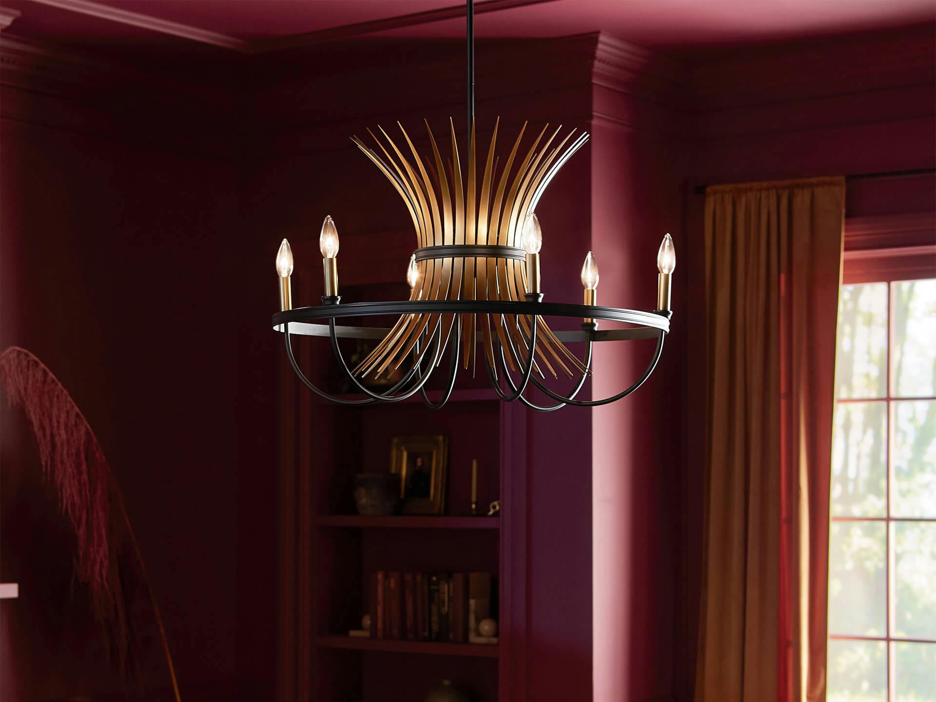 Baile chandelier illuminated in a deep red room