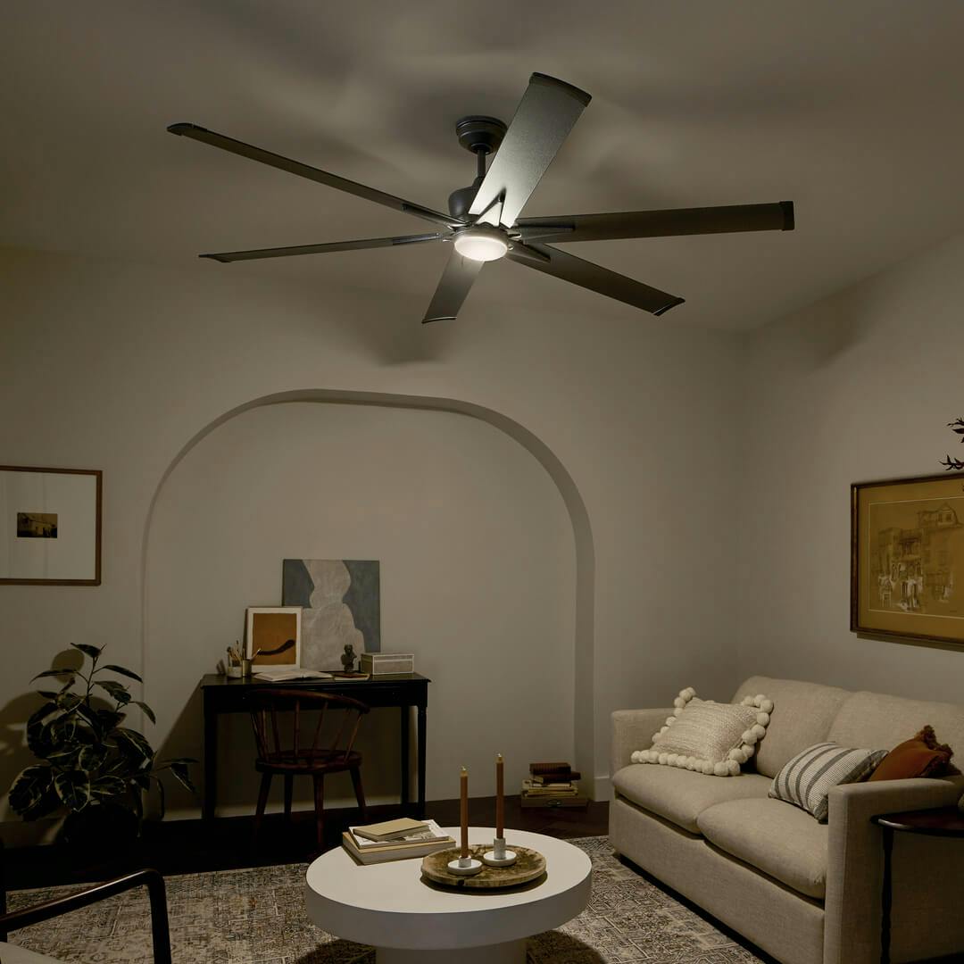 Night time living room with the Szeplo™ II LED 80" Fan Weathered Steel