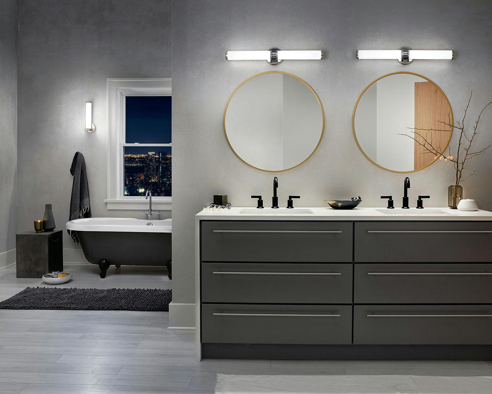 Night time Bathroom featuring Indeco vanity light 45685PNLED