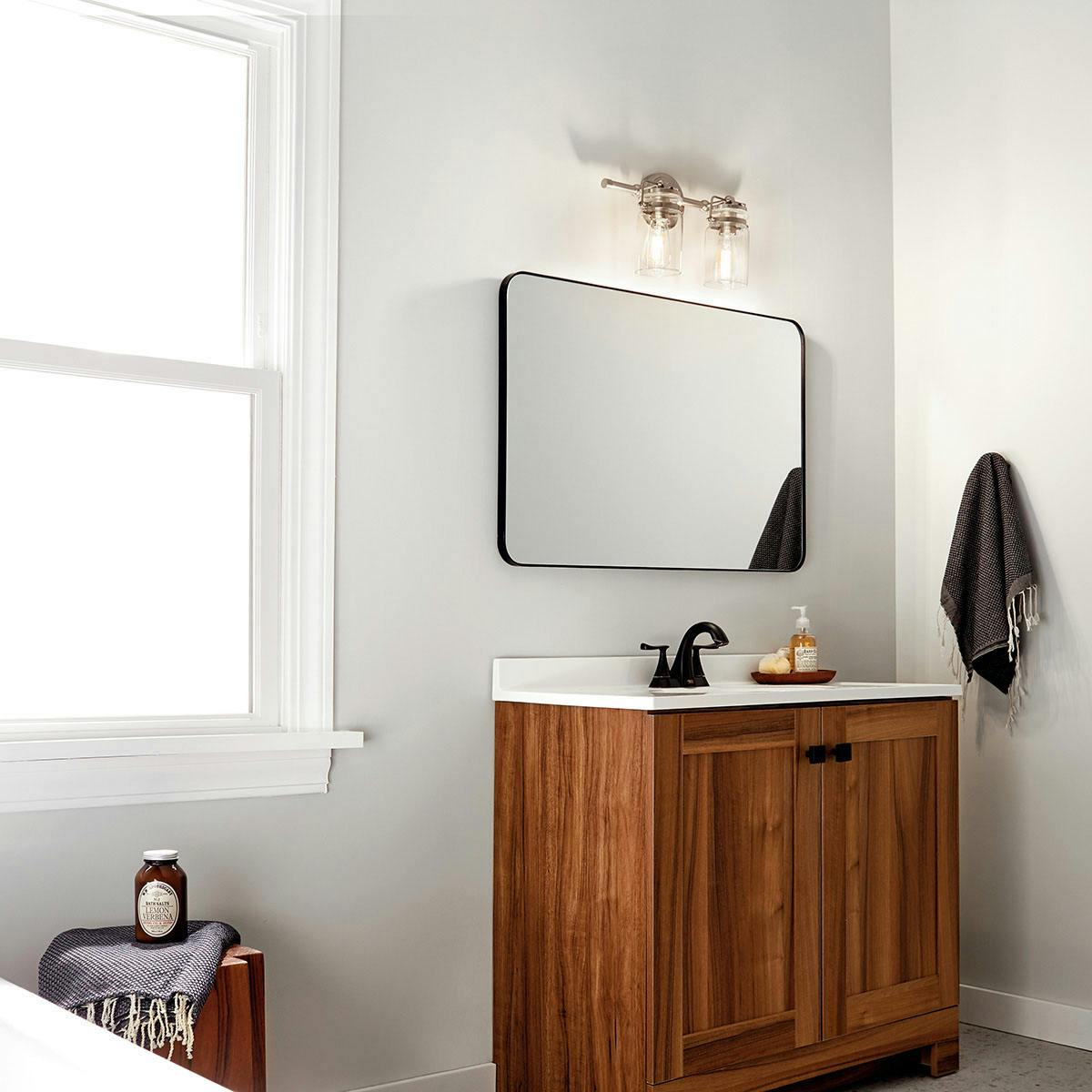 Day time Bathroom featuring Brinley vanity light 45688NI