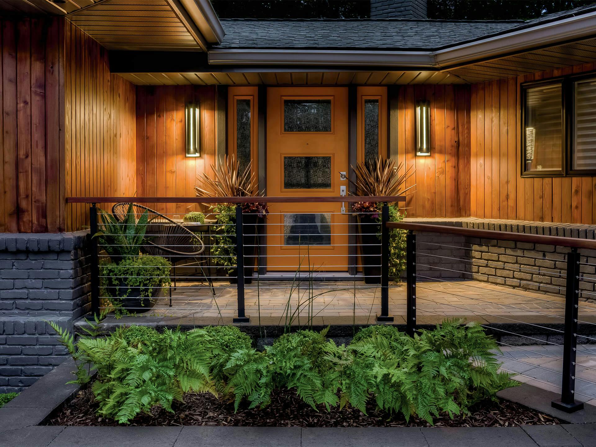 Outdoor entryway lit up by River Path Outdoor wall lights at night 
