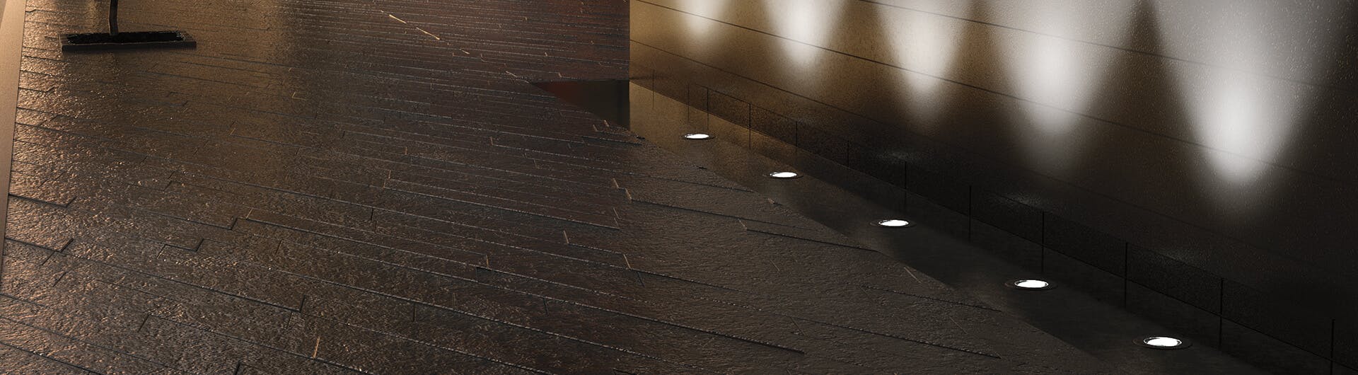 Five C-series in-ground lights in centennial brass along a pathway