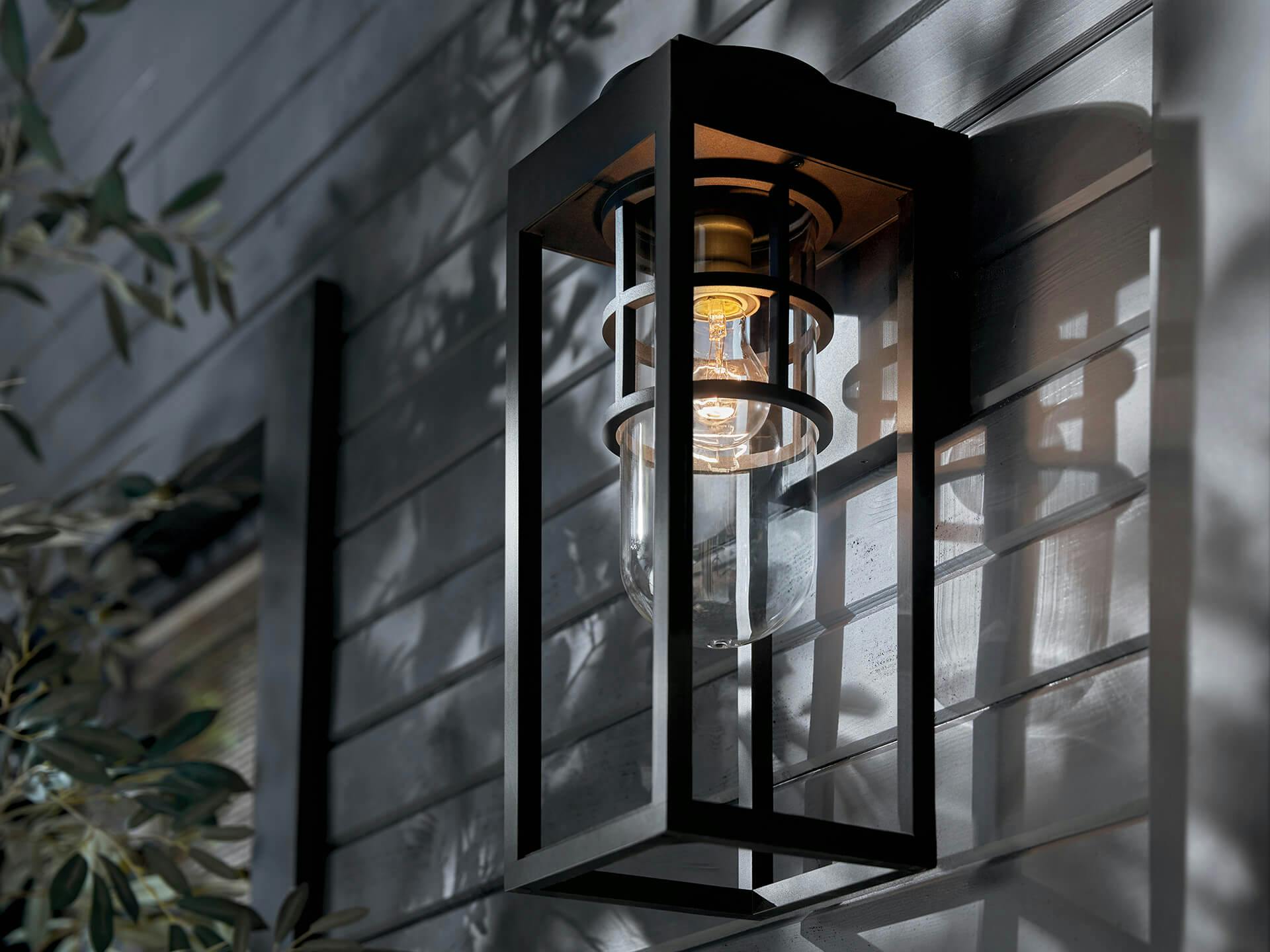 Close up of a Hone sconce in black at night