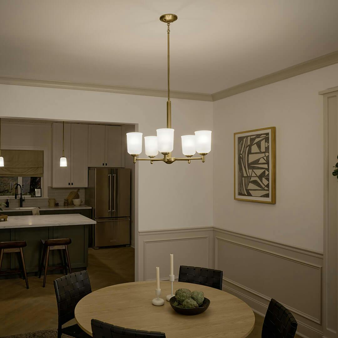 Dining Room night with the Shailene 18.5" 5-Light Chandelier in Natural Brass