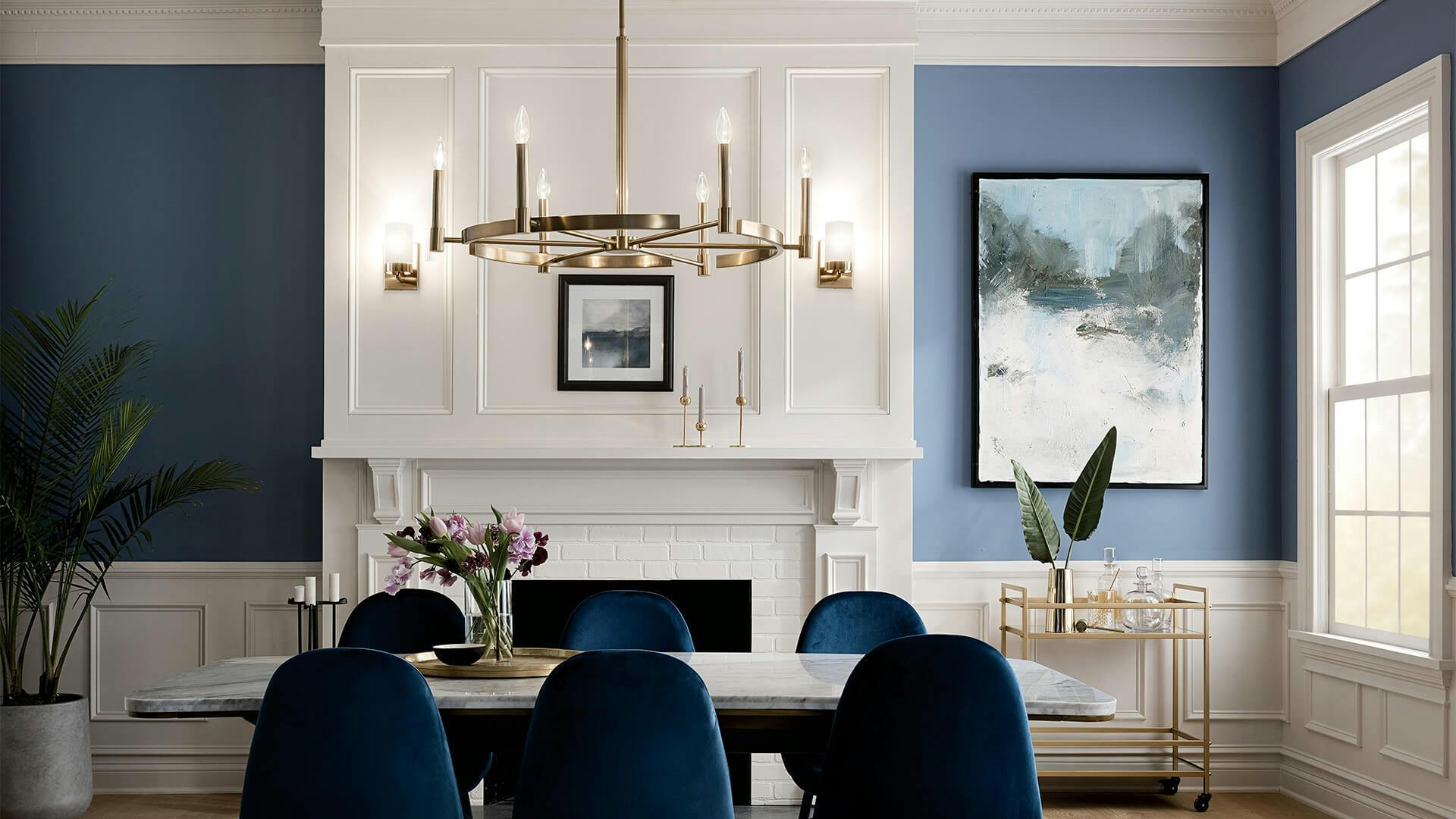 Dining room with blue walls and features Tolani chandelier