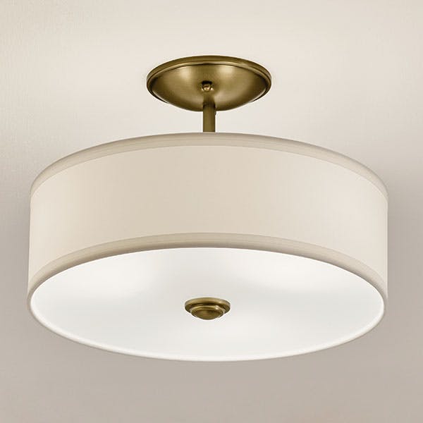 Bathroom at daytime with the Shailene 11.5" 3-Light Small Round Semi Flush in Natural Brass shown