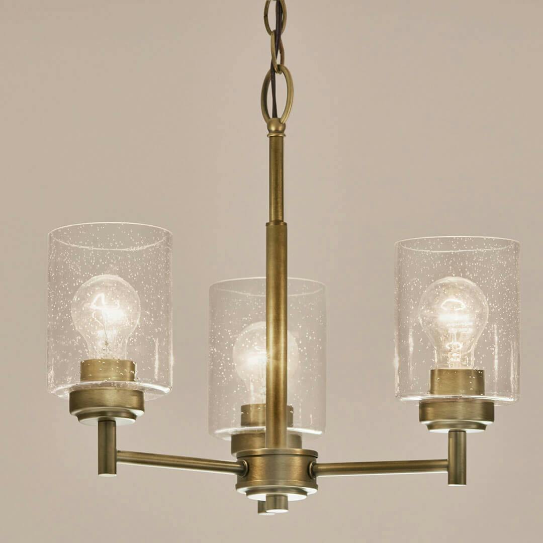 Bathroom in day light with the Winslow 15.5" 3-Light Chandelier in Natural Brass