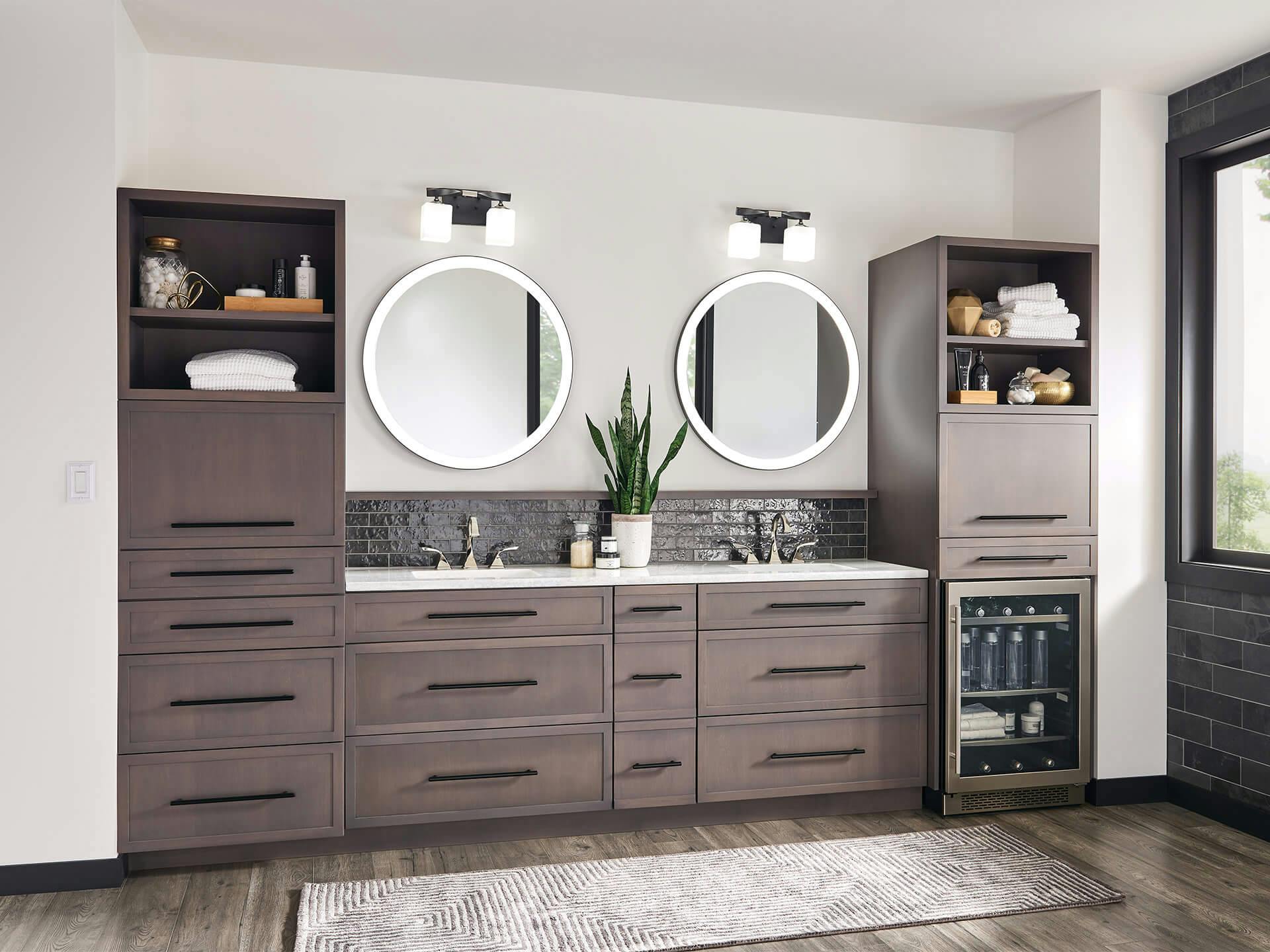 Jack and Jill style bathroom with two Ryame mirrors lit above with Marette vanity lights in the daytime