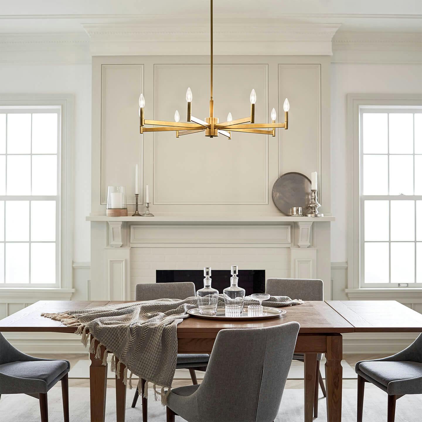 Bright dining room with Erzo chandelier and tapered light bulbs
