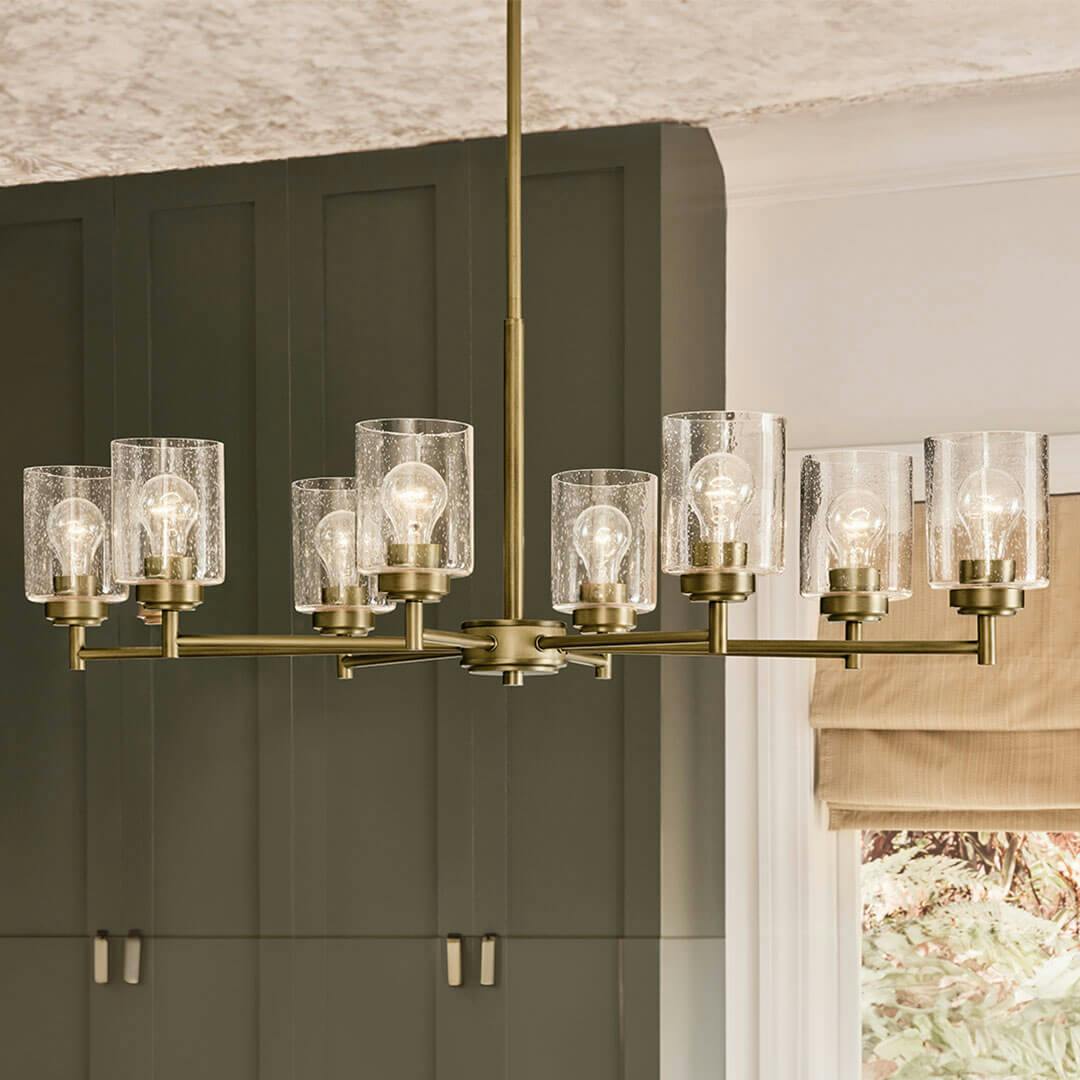 Kitchen in day light with the Winslow 14.75" 8-Light Chandelier in Natural Brass