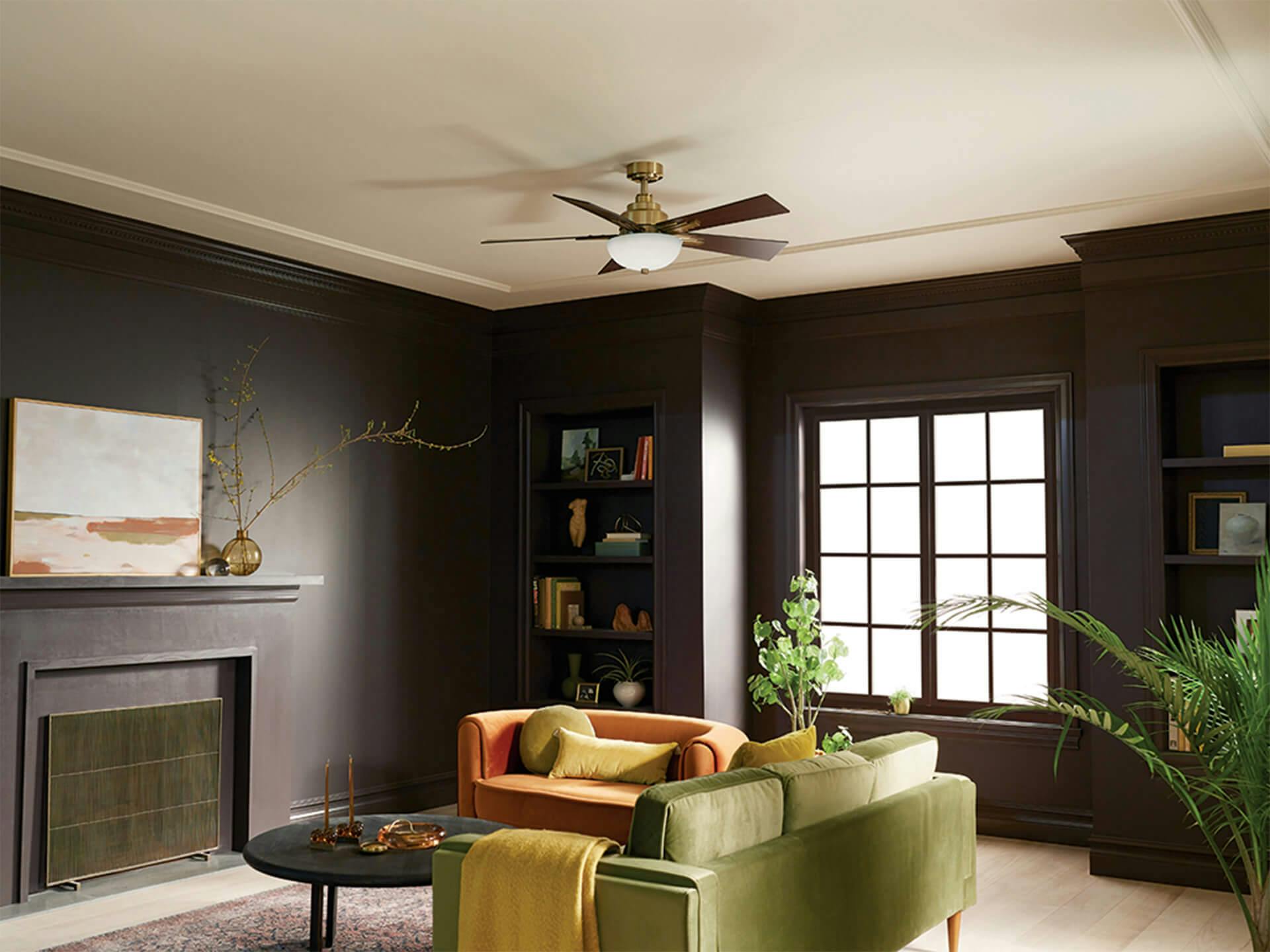 Living room with Vinea ceiling fan in brushed natural brass.