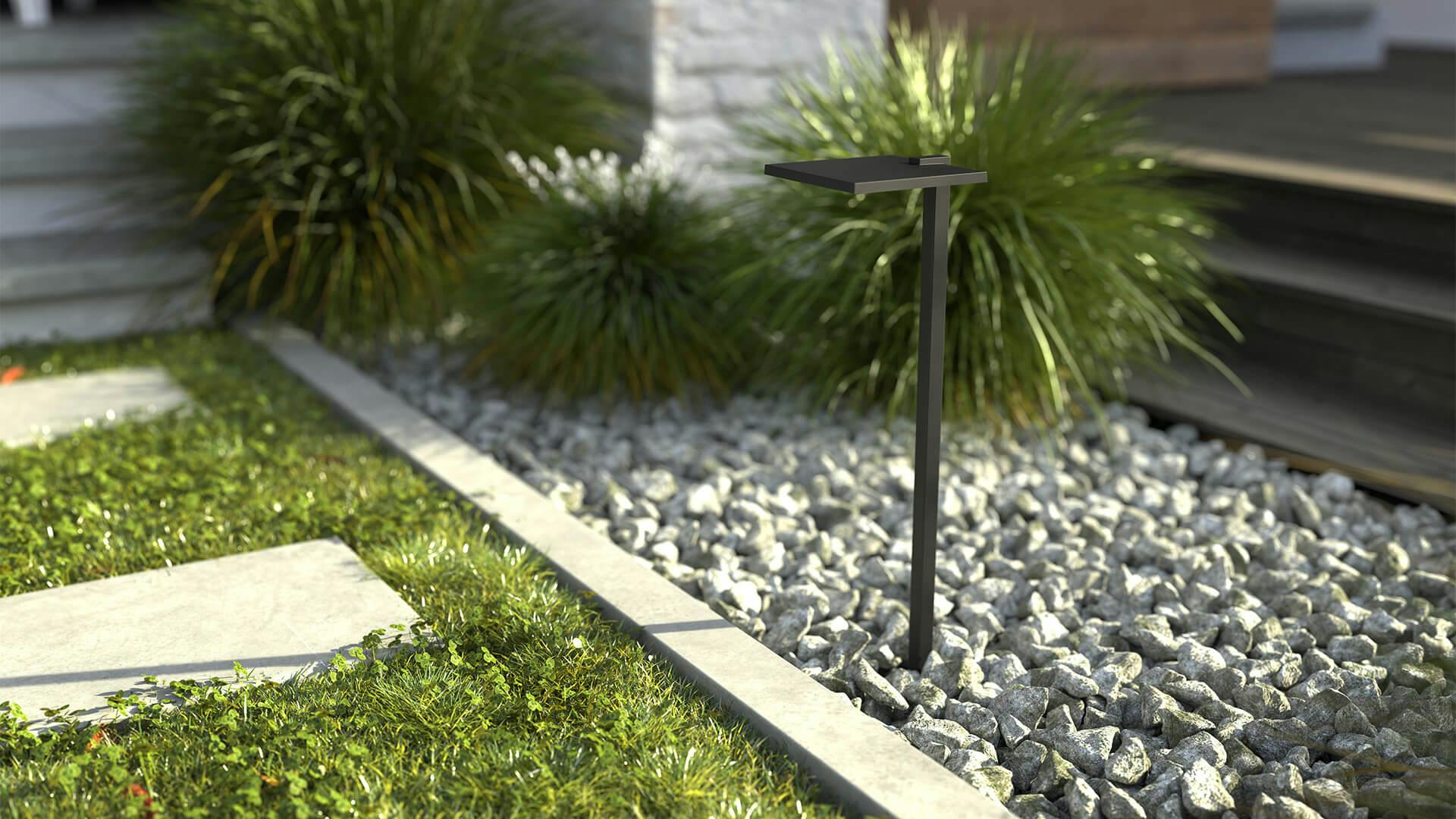 Walkway with LED path light in textured black in front of ornamental grass landscaping