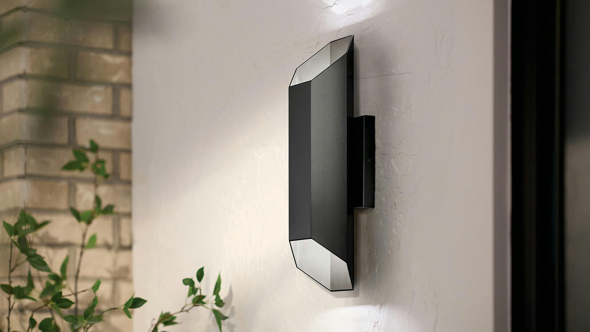 Estella sconce in black finish close up on an exterior wall