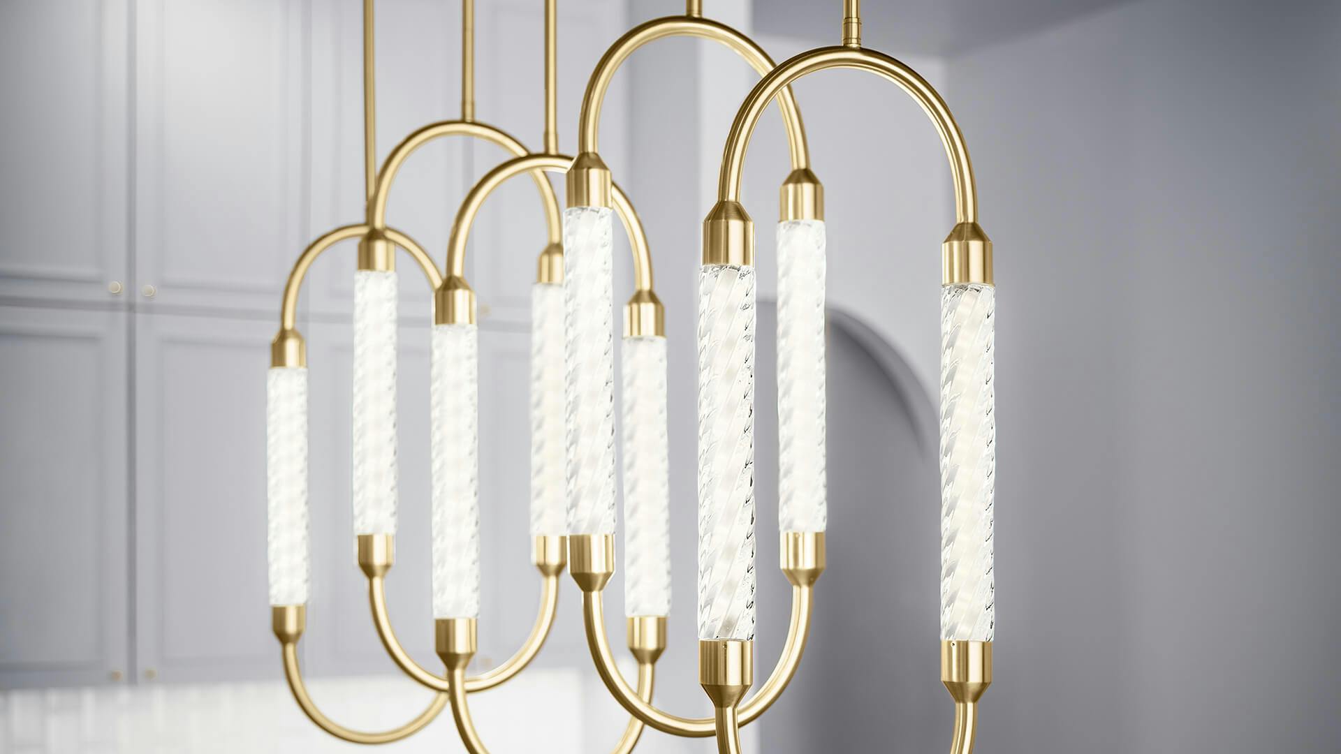 Close up image of a Delsey chandelier in gold finish