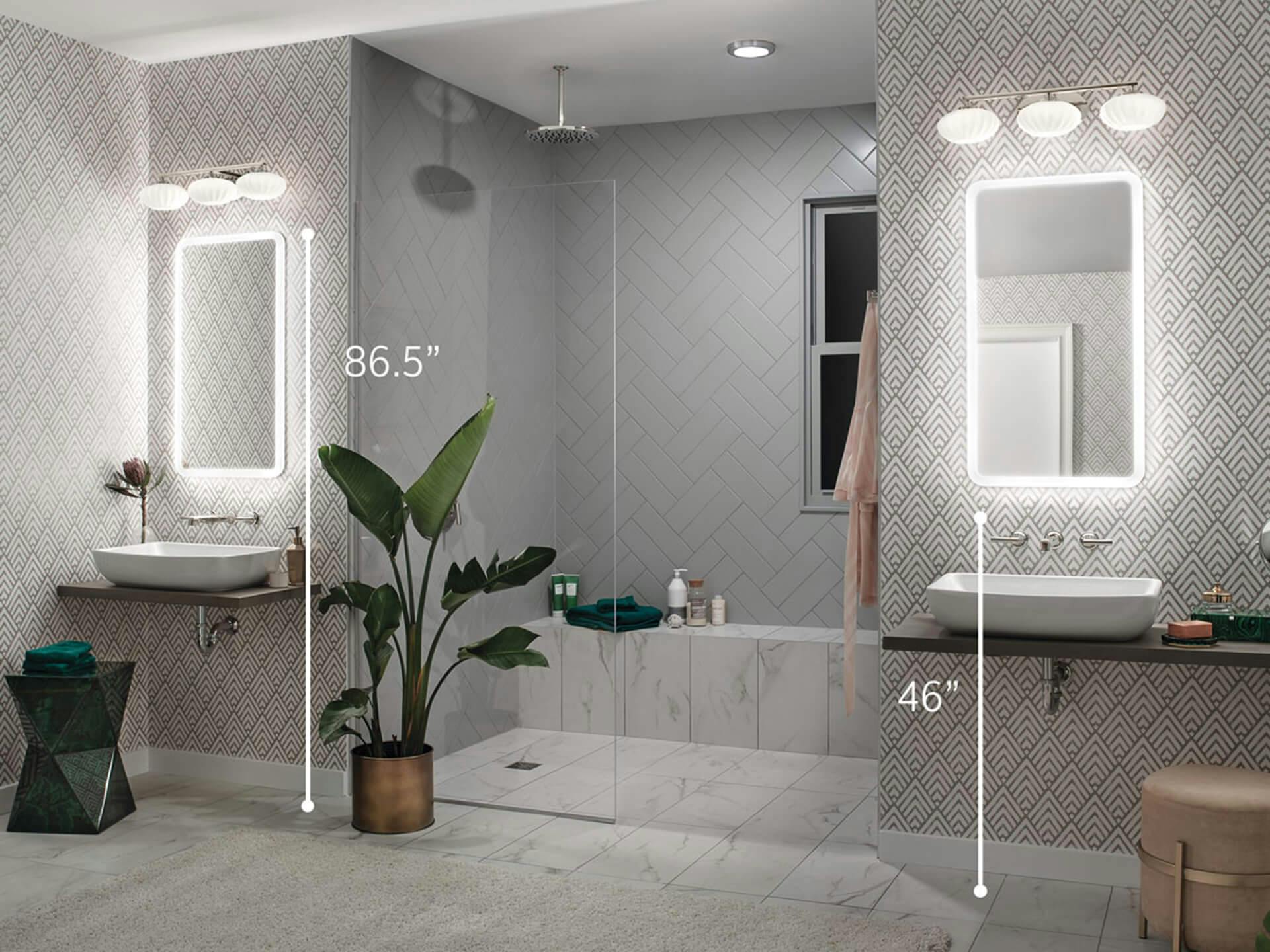 Dual vanity bathroom at night featuring Pim vanity lights above mirrors, illustrating how the lights are 86.5 inches above the ground and the bottom edge of the mirrors are 46 inches from the ground