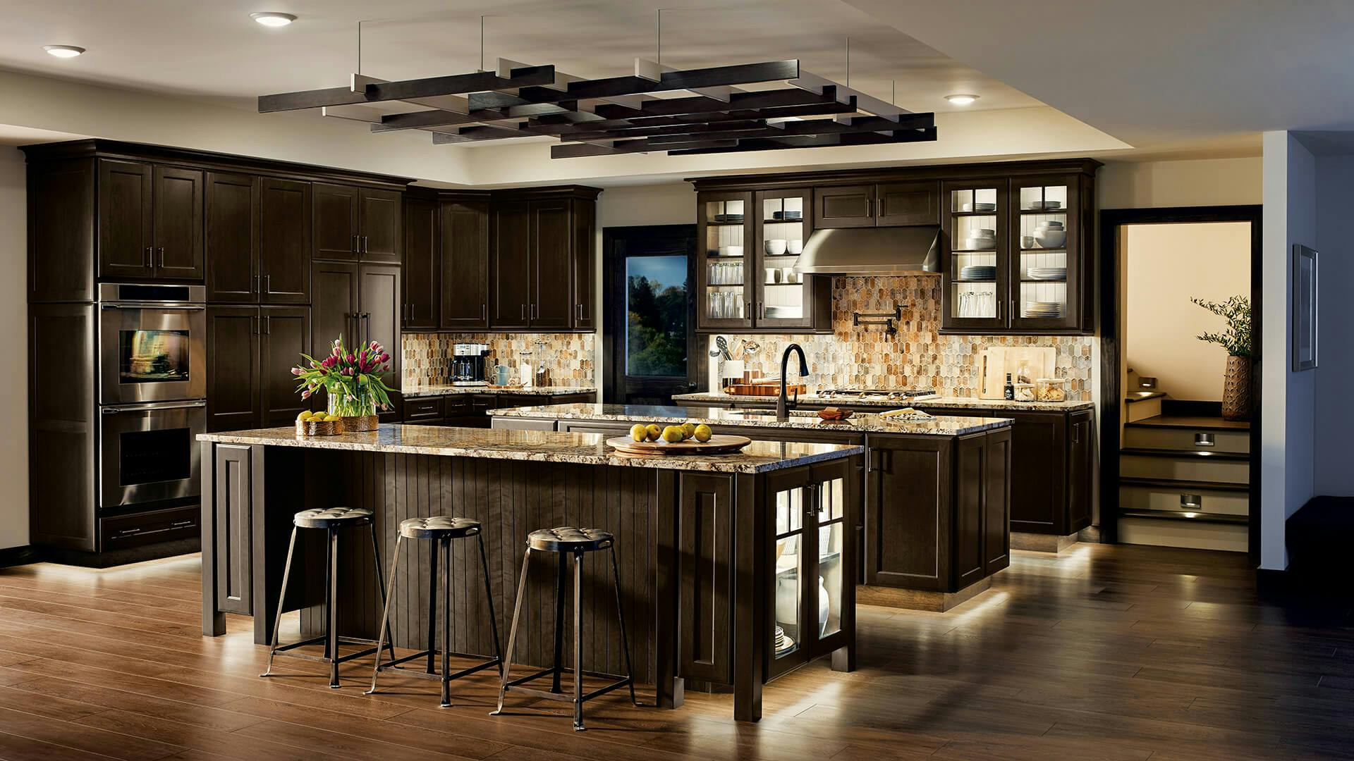 Kitchen aglow with 6TL Dry Tape Lights underneath the island and cabinets along with several downlights on the ceiling