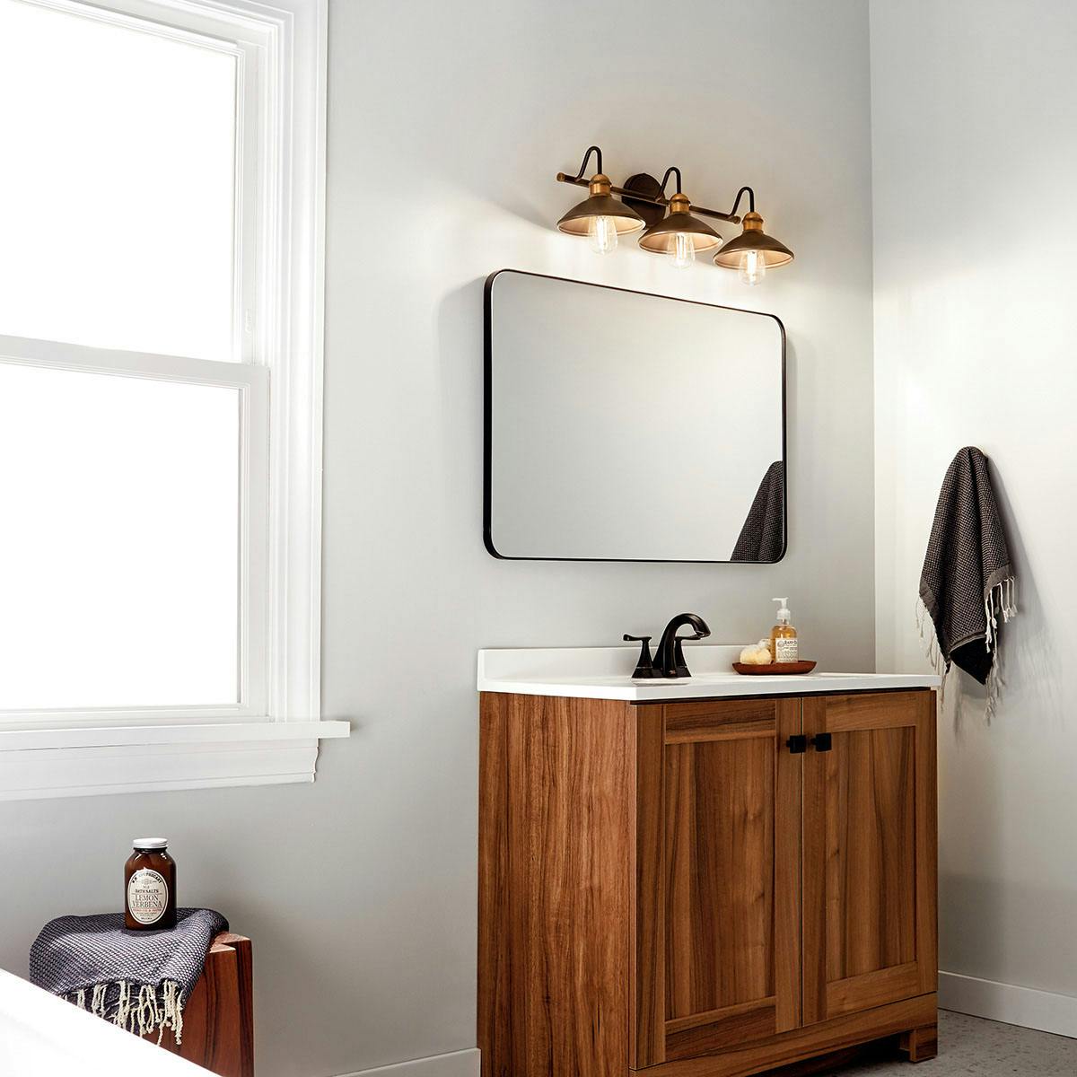 Day time Bathroom featuring Clyde vanity light 45945OZ