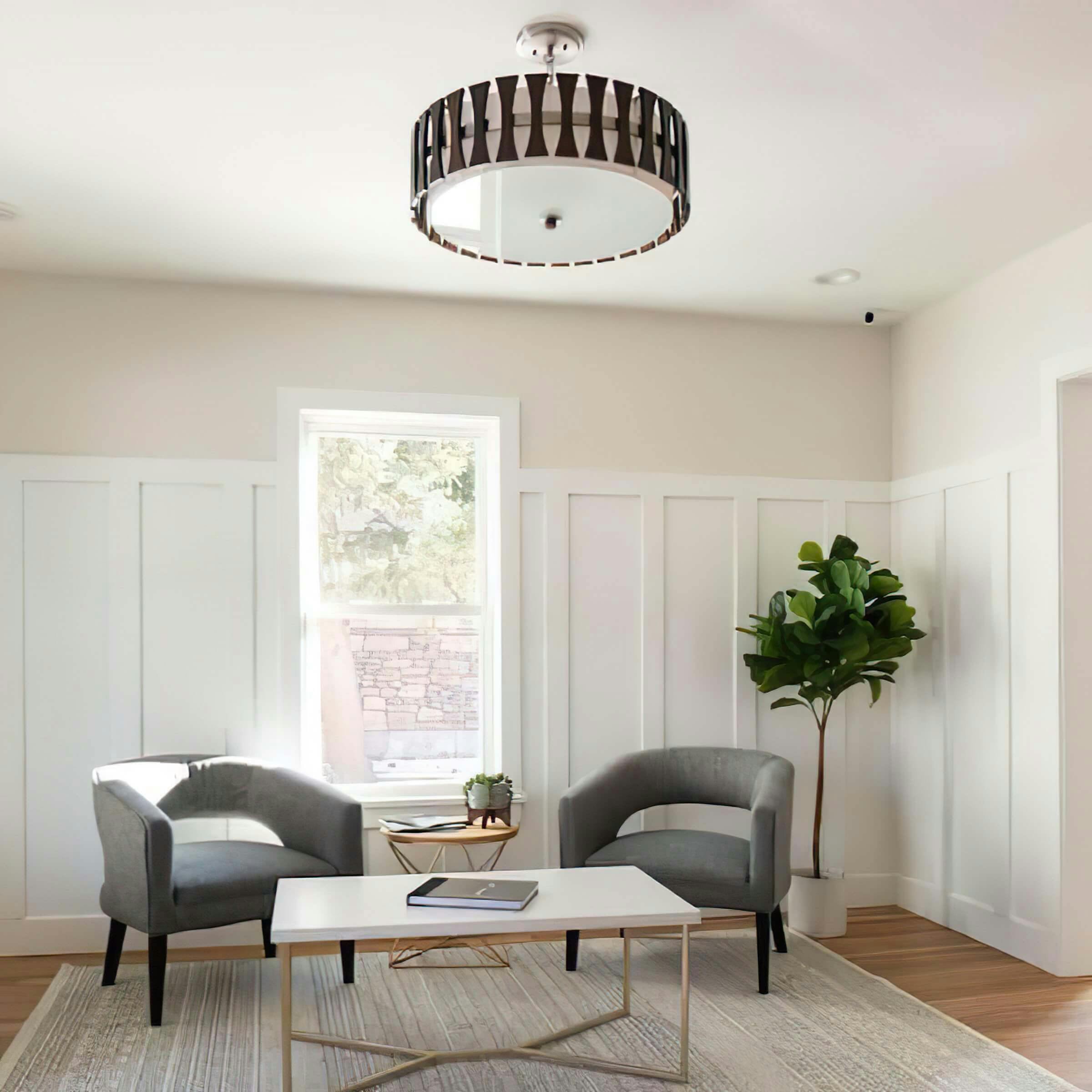 Sitting area with Kichler semi-flush hanging over 2 chairs