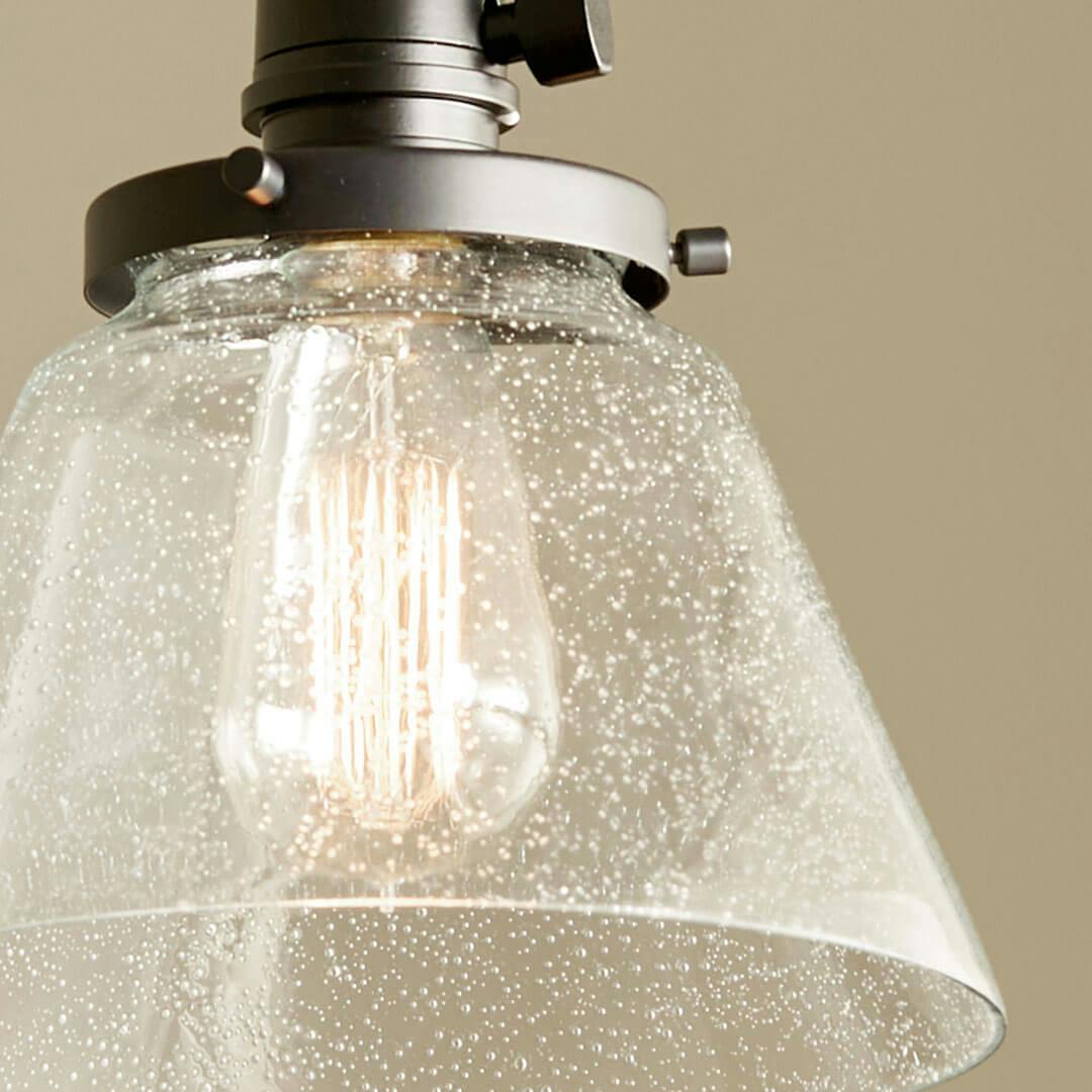 Close up of the Avery 9 Inch 1 Light Cone Mini Pendant with Clear Seeded Glass in Black