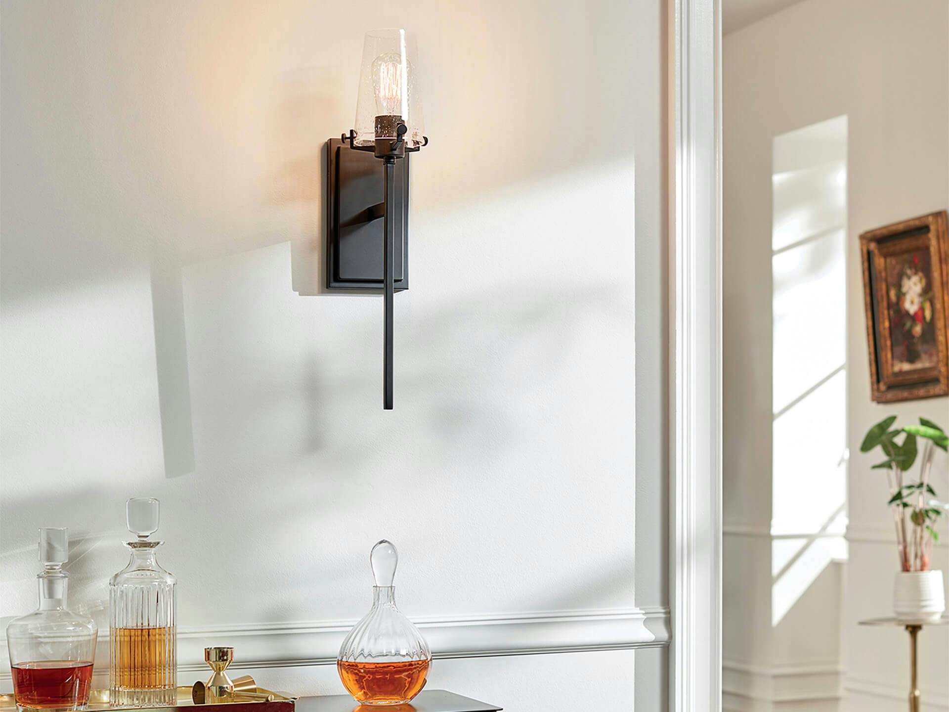 Alton wall sconce above a bar cabinet