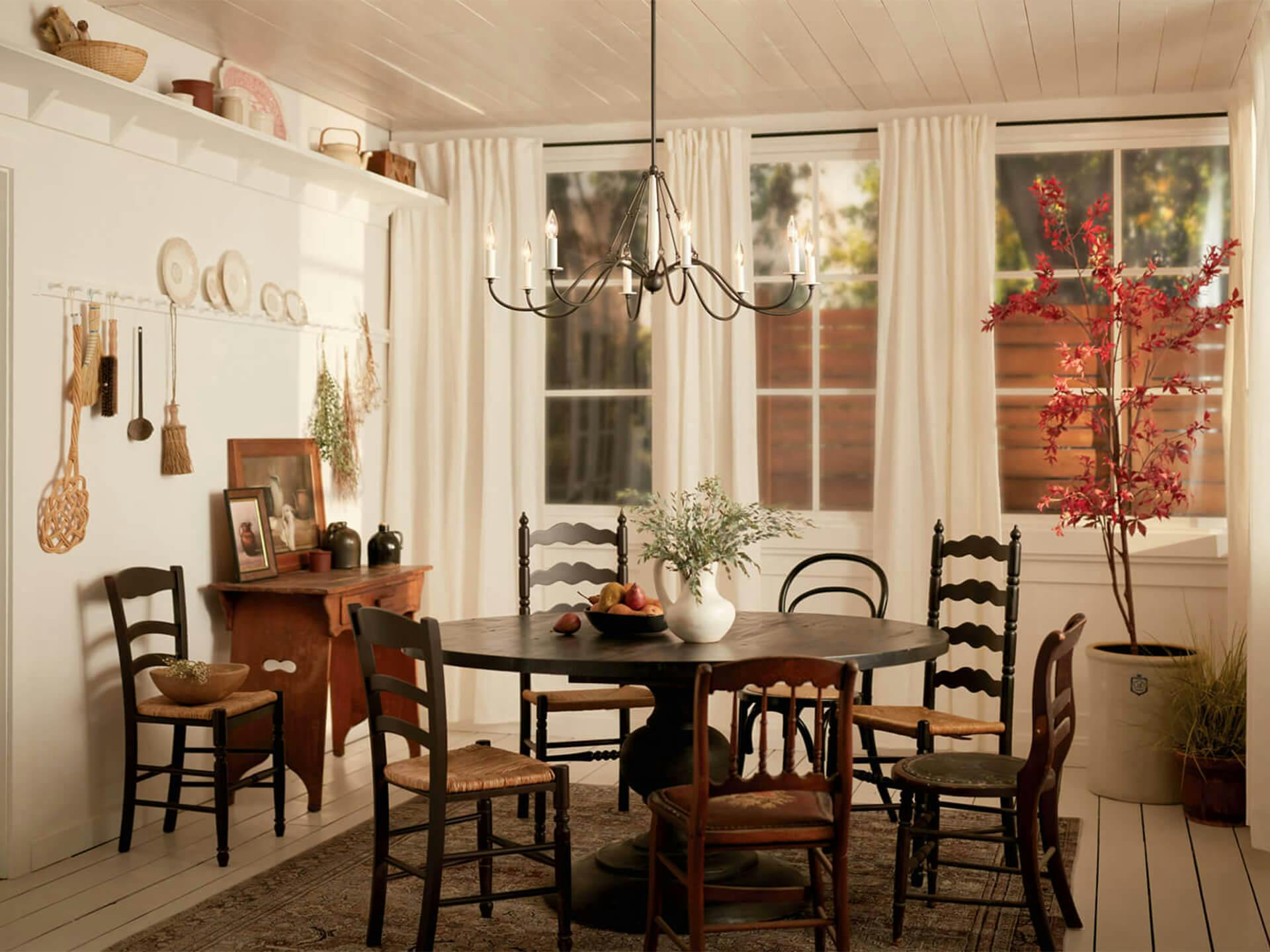 daytime porch setting featuring Freesia chandelier above a dining table