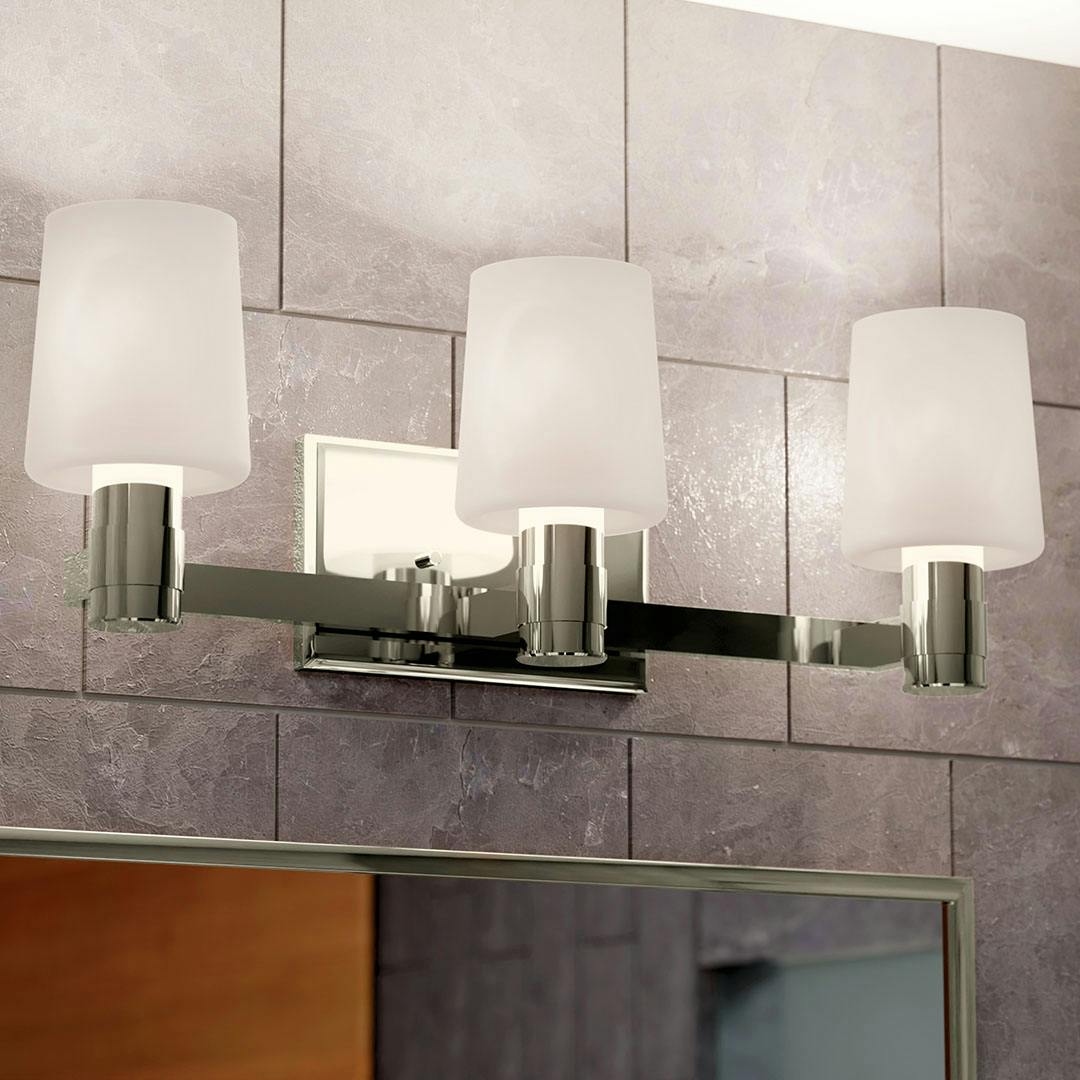 Bathroom in daylight with the Adani 24 Inch 3 Light Vanity Light with Opal Glass in Polished Nickel