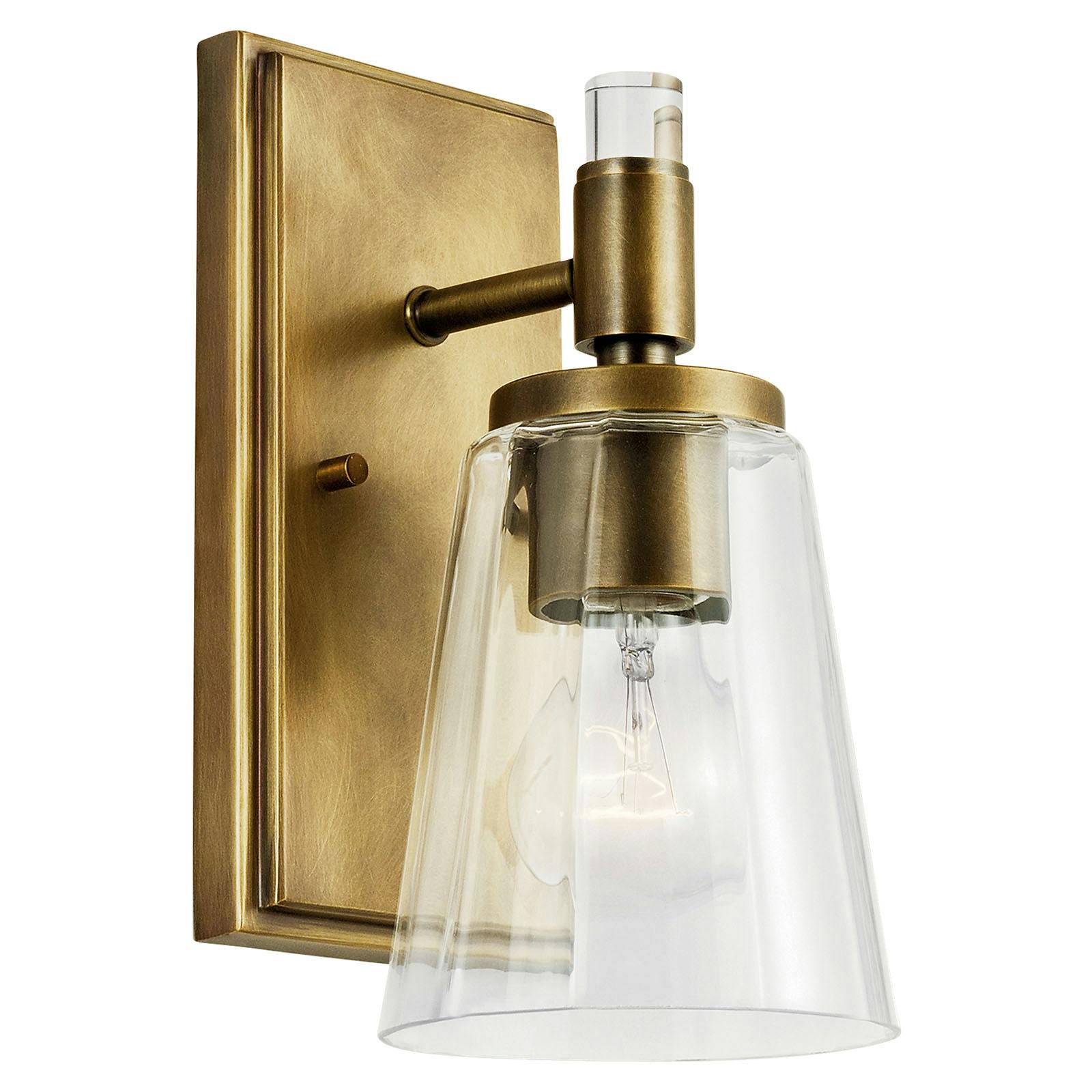 The Audrea™ 1 Light Wall Sconce Natural Brass facing down on a white background