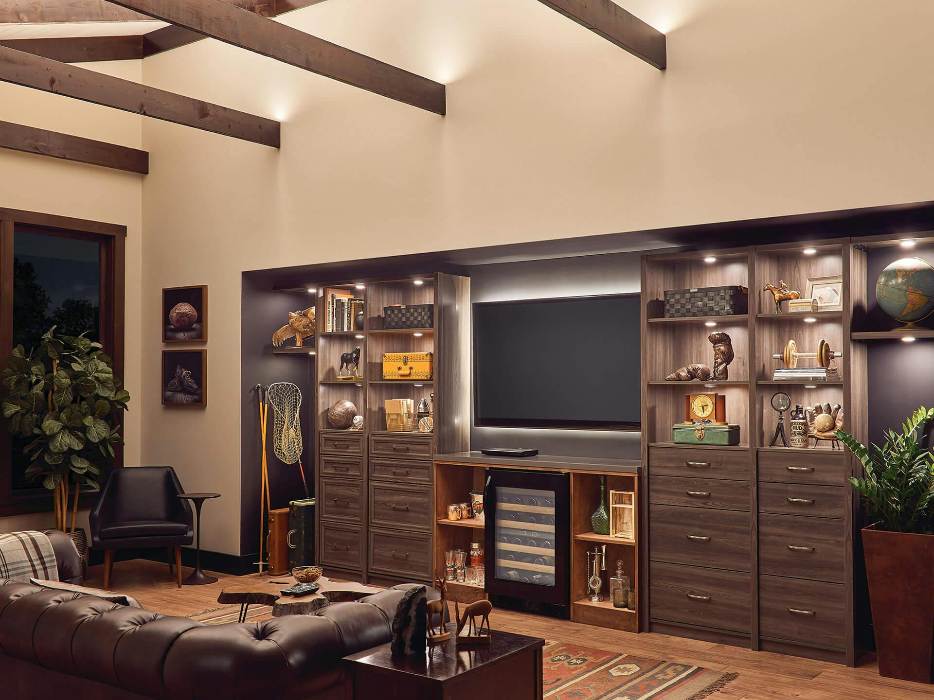 Evening living room den with variety of cabinet lighting