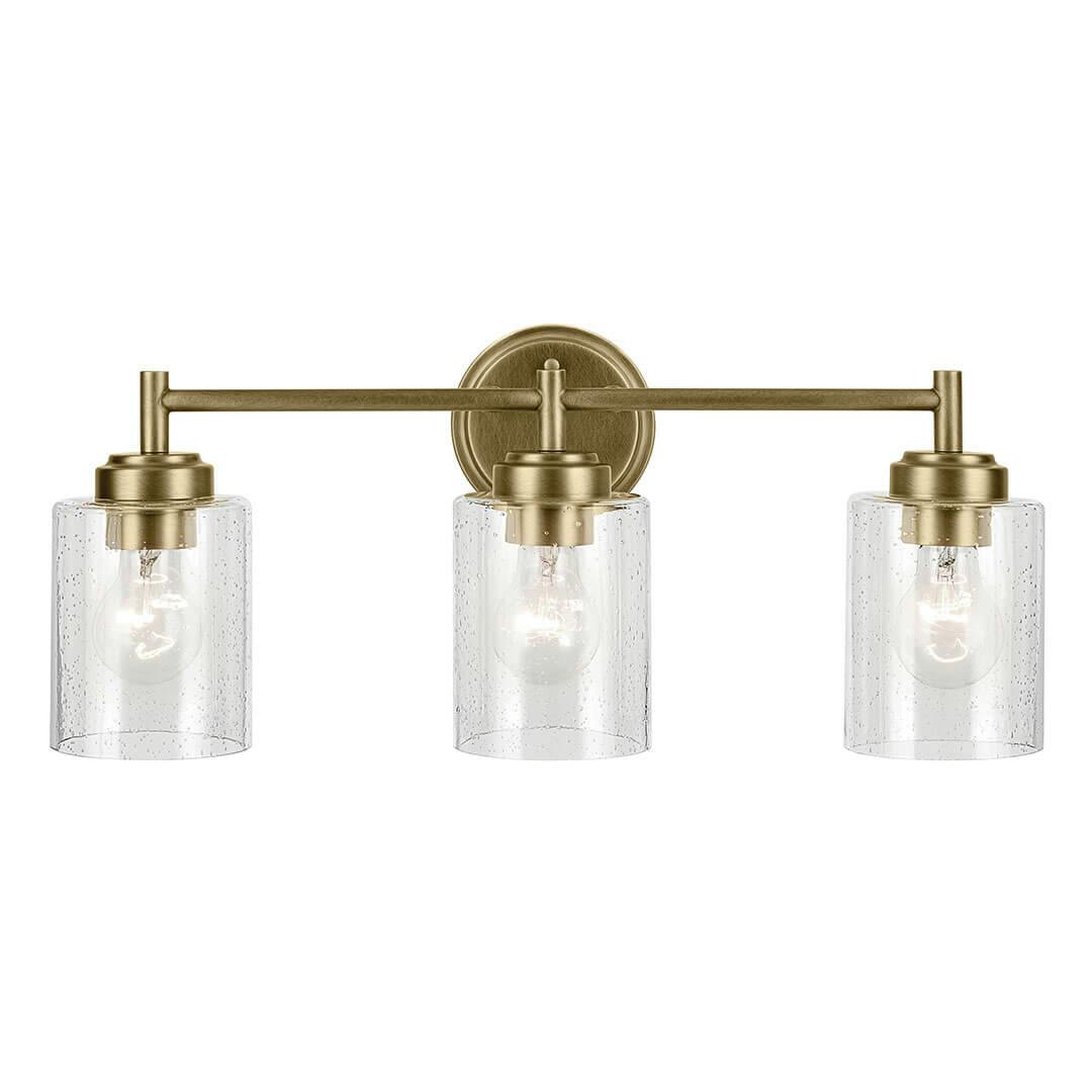 The Winslow 21.5" 3-Light Vanity Light in Natural Brass mounted down on a white background