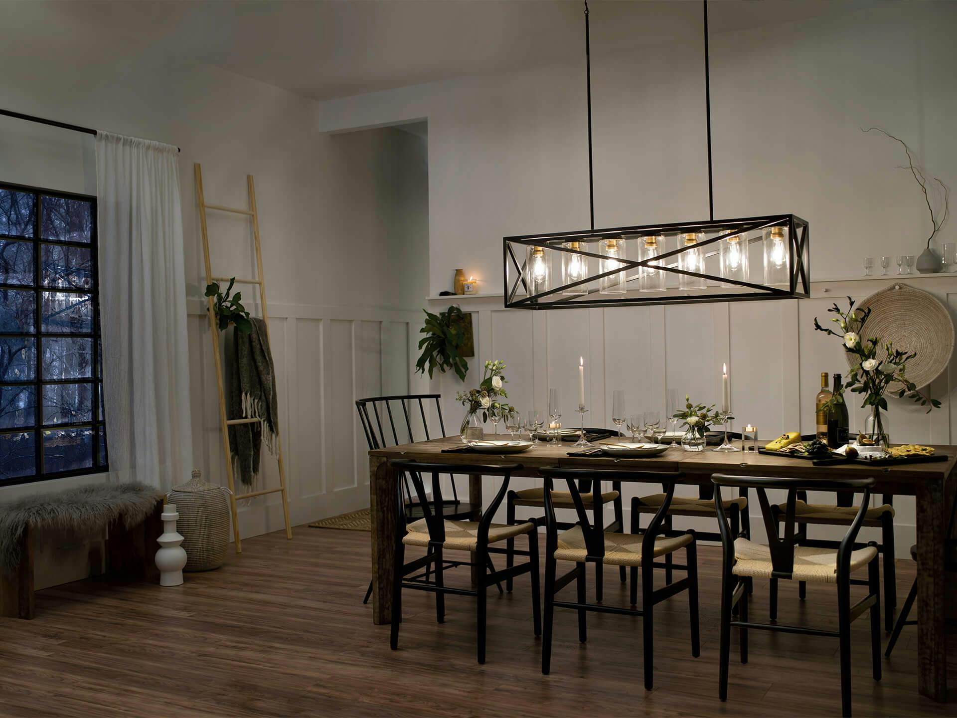 Dining room at night with Moorgate 7-light chandelier in black.