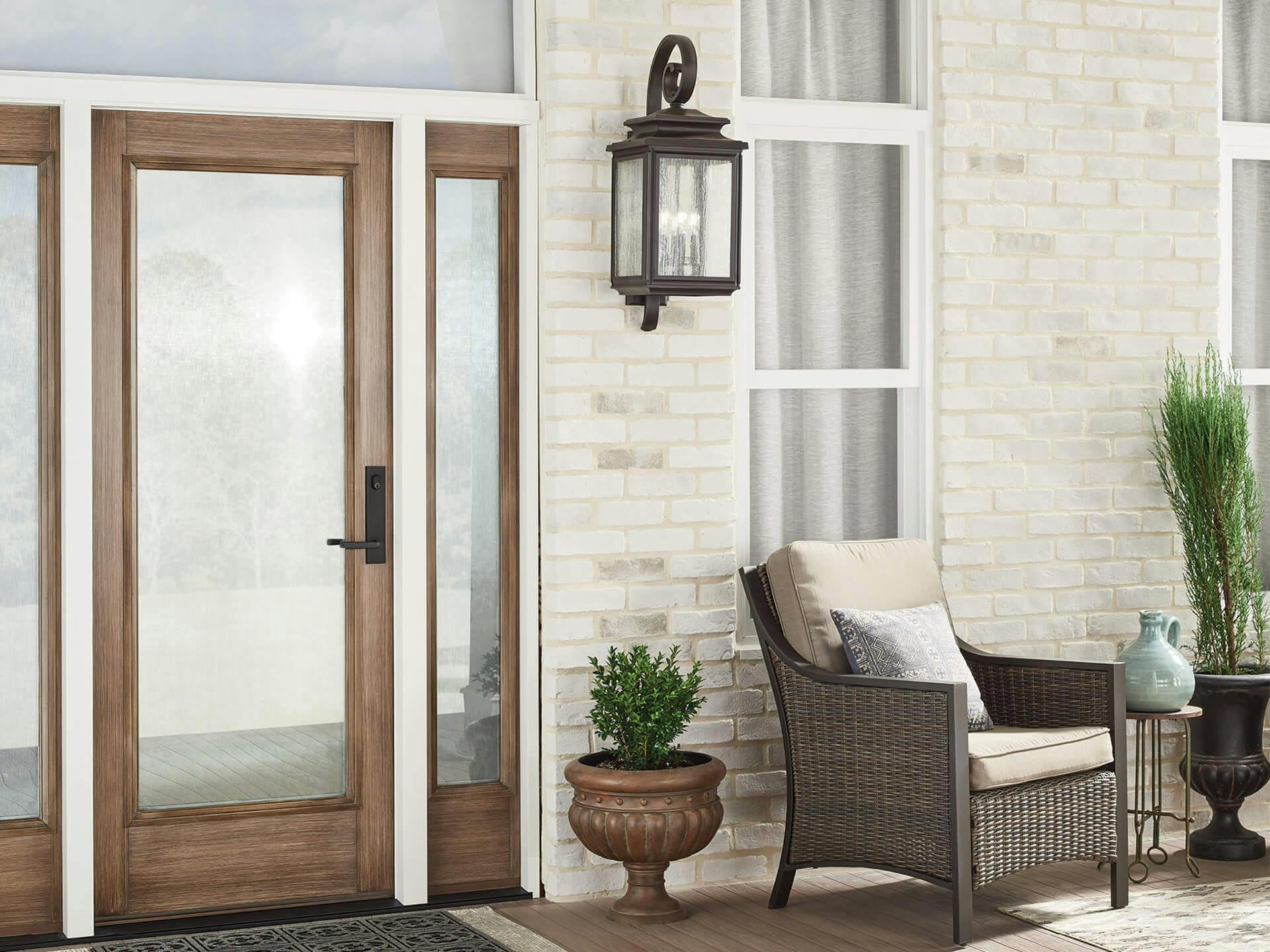 Image of a front porch with a Wiscombe Park exterior wall light mounted to the side of the door 